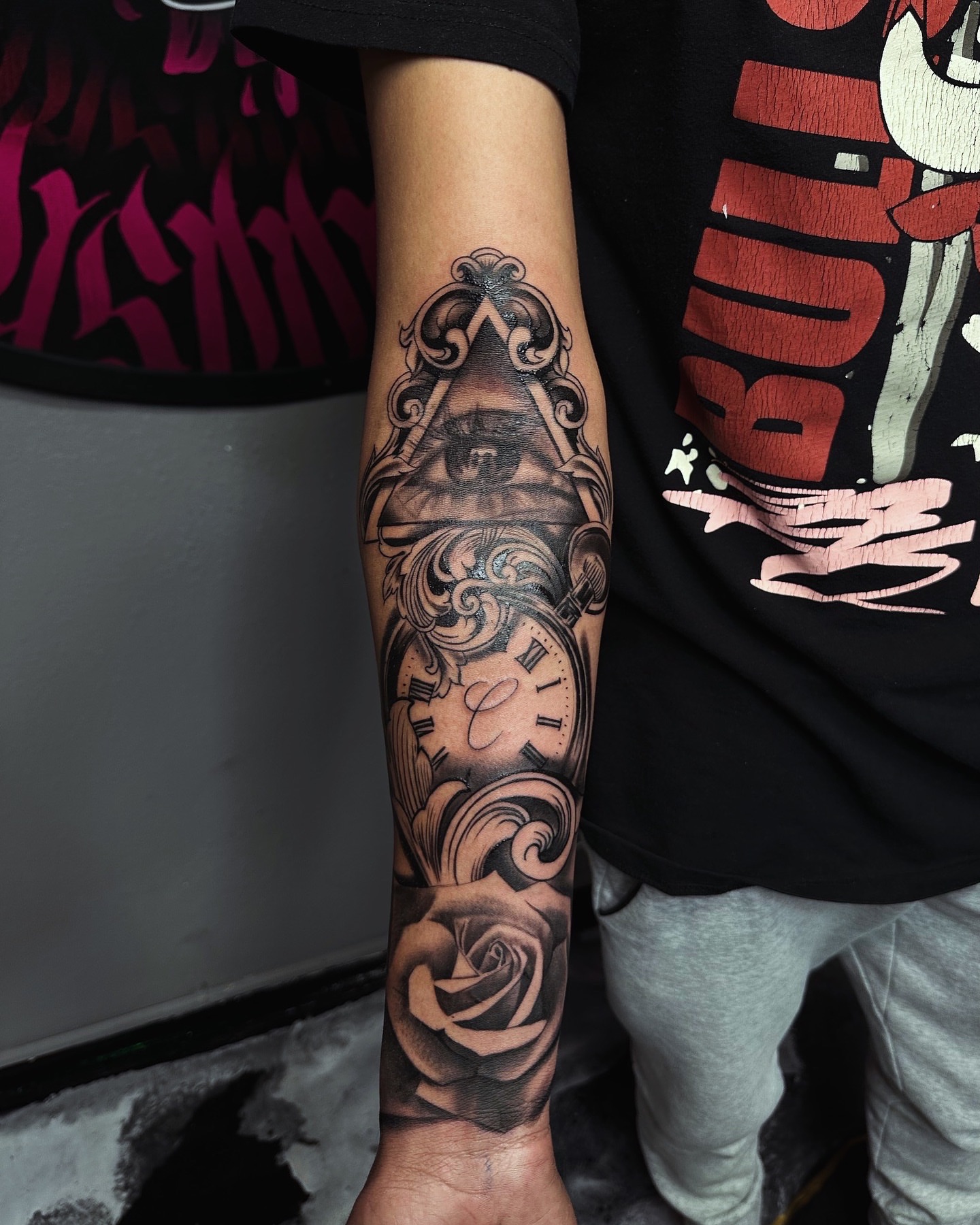 Eye and clock geometric tattoo on the forearm by 📍 Austin