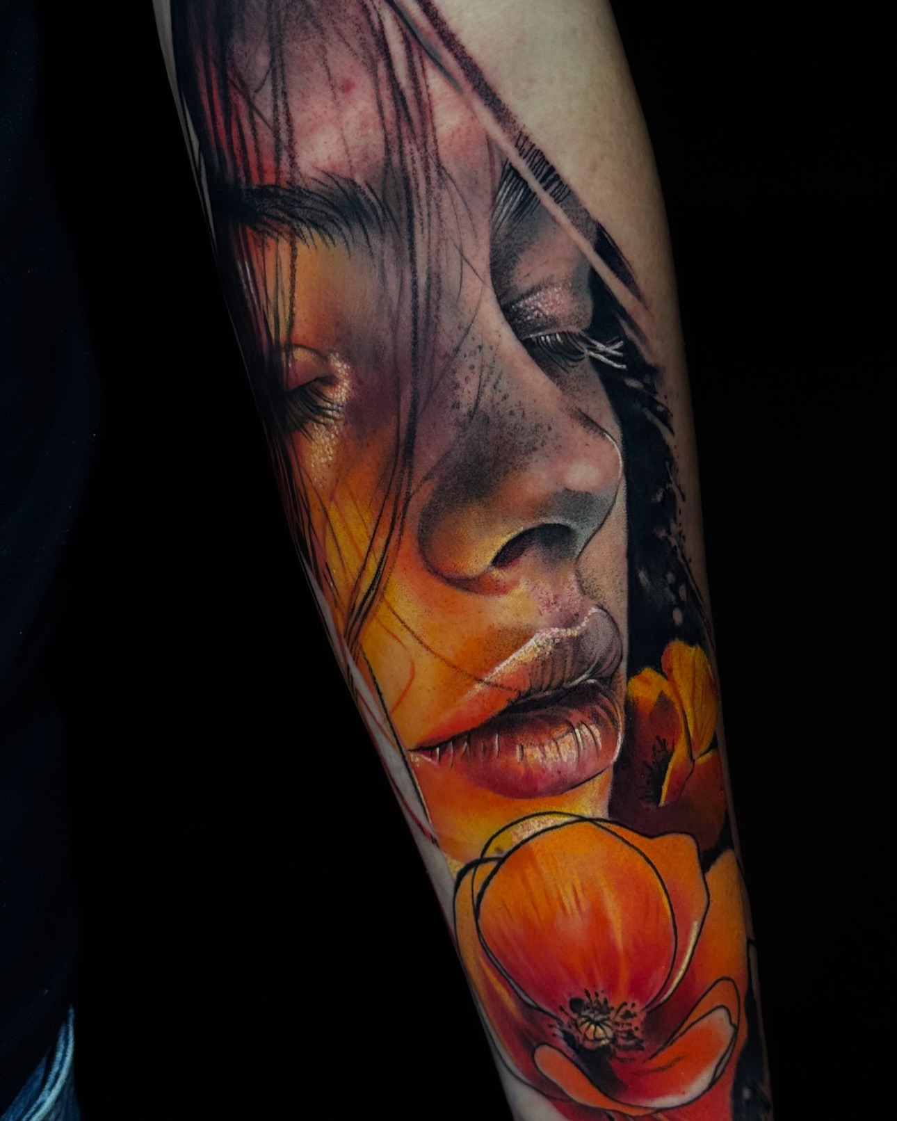Woman with flowers realism tattoo on the forearm by Juan Pablo Molina