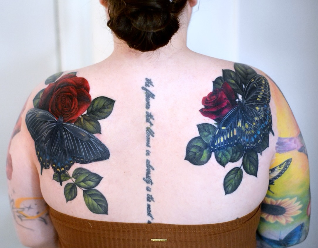 Butterfly and rose realism tattoo on the back by Joice Wang