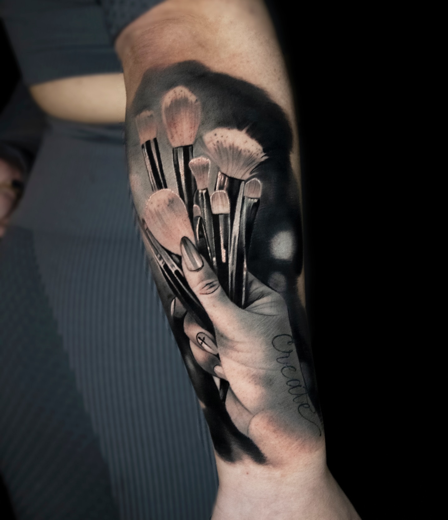 Makeup brushes realism tattoo on the forearm by Luke Benavidez