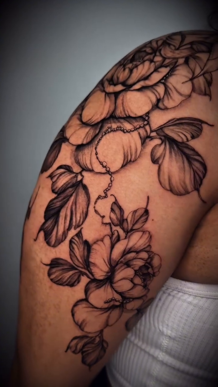 Floral tattoo on shoulder and arm dotwork tattoo on the shoulder by Nyc Tattoo Manhattan