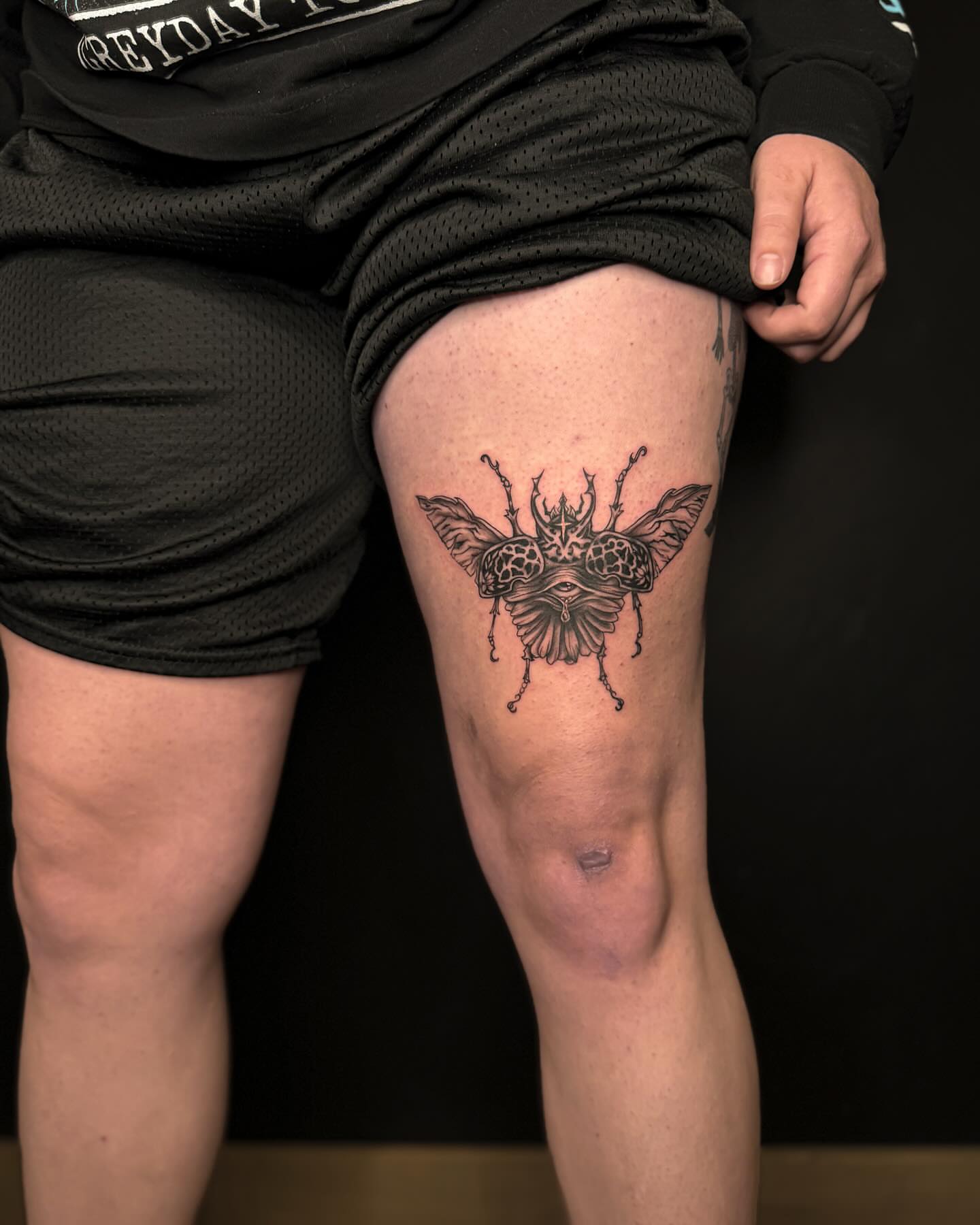 Insect black and grey tattoo on the thigh by Jewels, St. George, Utah