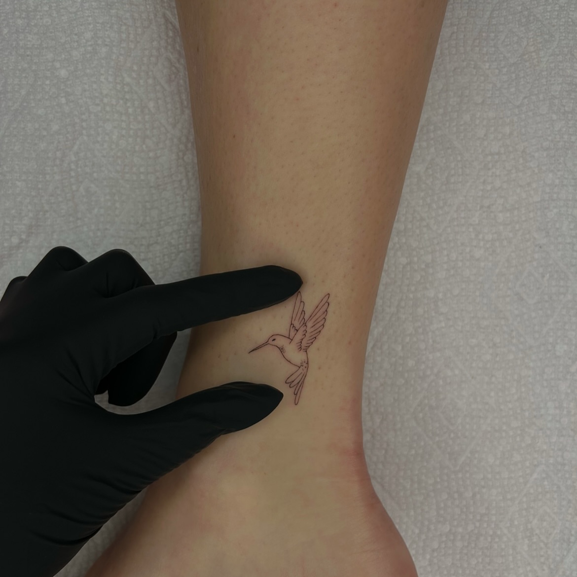 Hummingbird minimalist tattoo by Kennedy Ramey