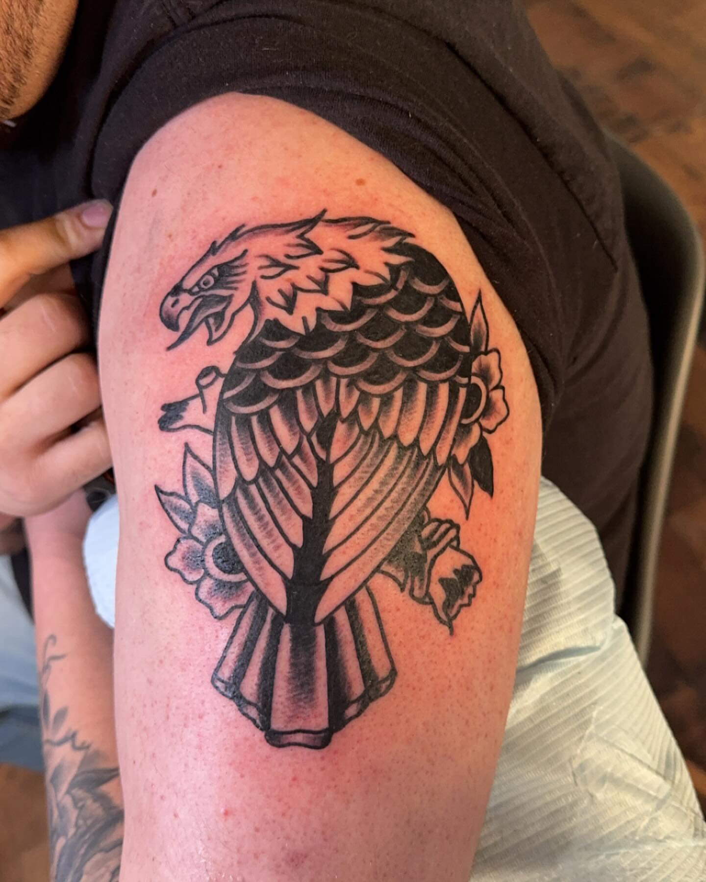 Eagle black and grey tattoo on the shoulder by Robbie Roberson