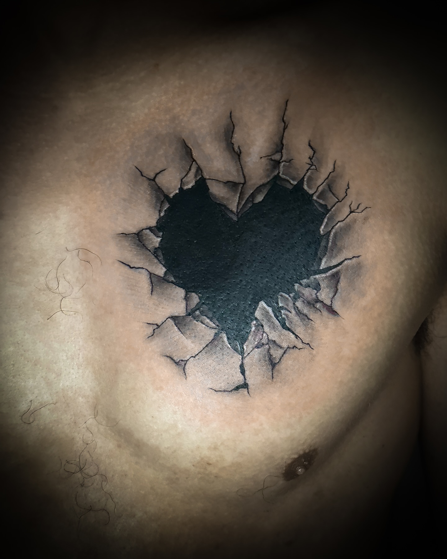 Heart black and grey tattoo on the chest by Juan c munoz jr, Chicago, Illinois