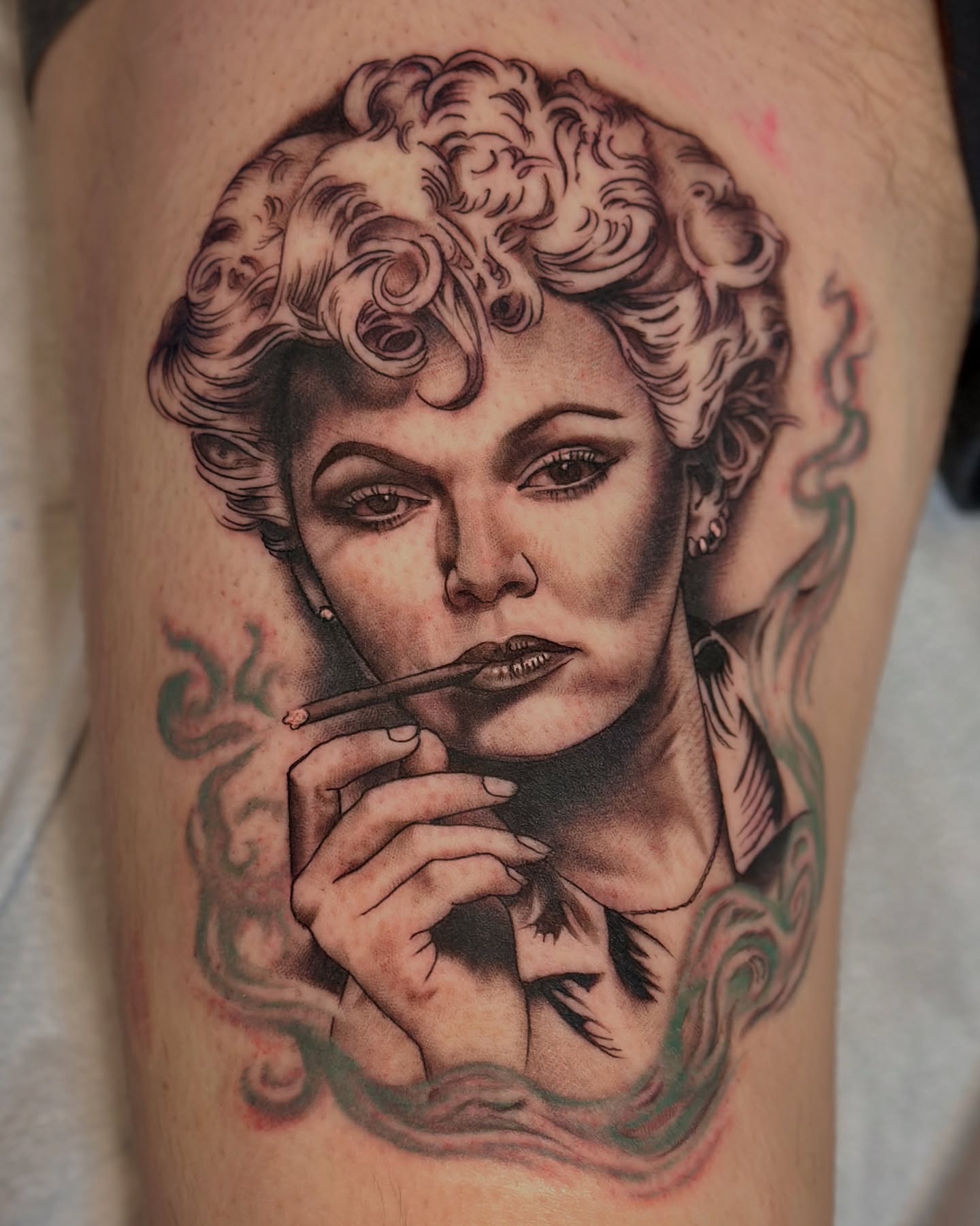 Woman smoking realism tattoo on the thigh by Holly Ellis, San Francisco, California