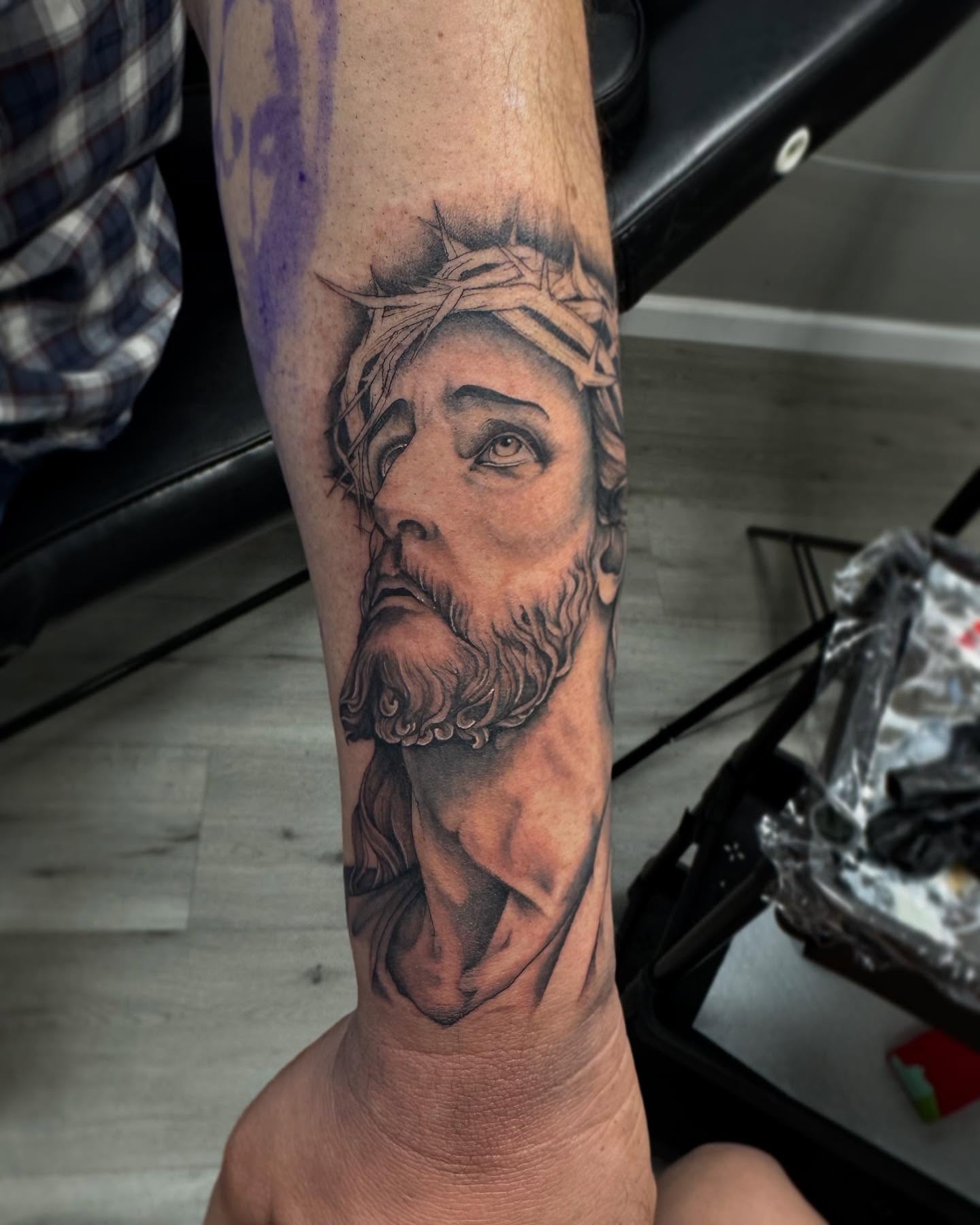 Religious figure realism tattoo on the forearm by Mo Dinero🎰