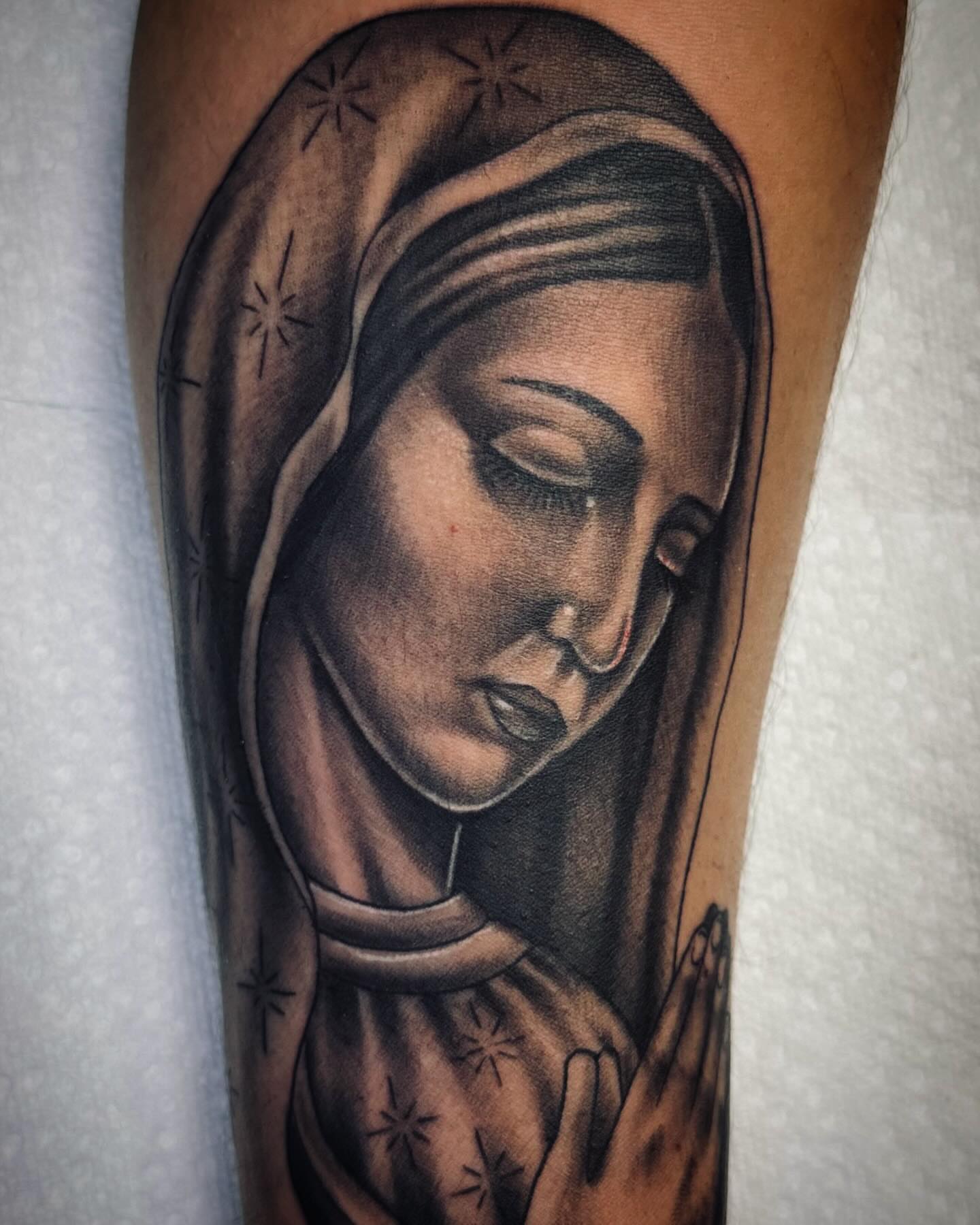 Religious figure black and grey tattoo on the forearm by Jameson William Cowan