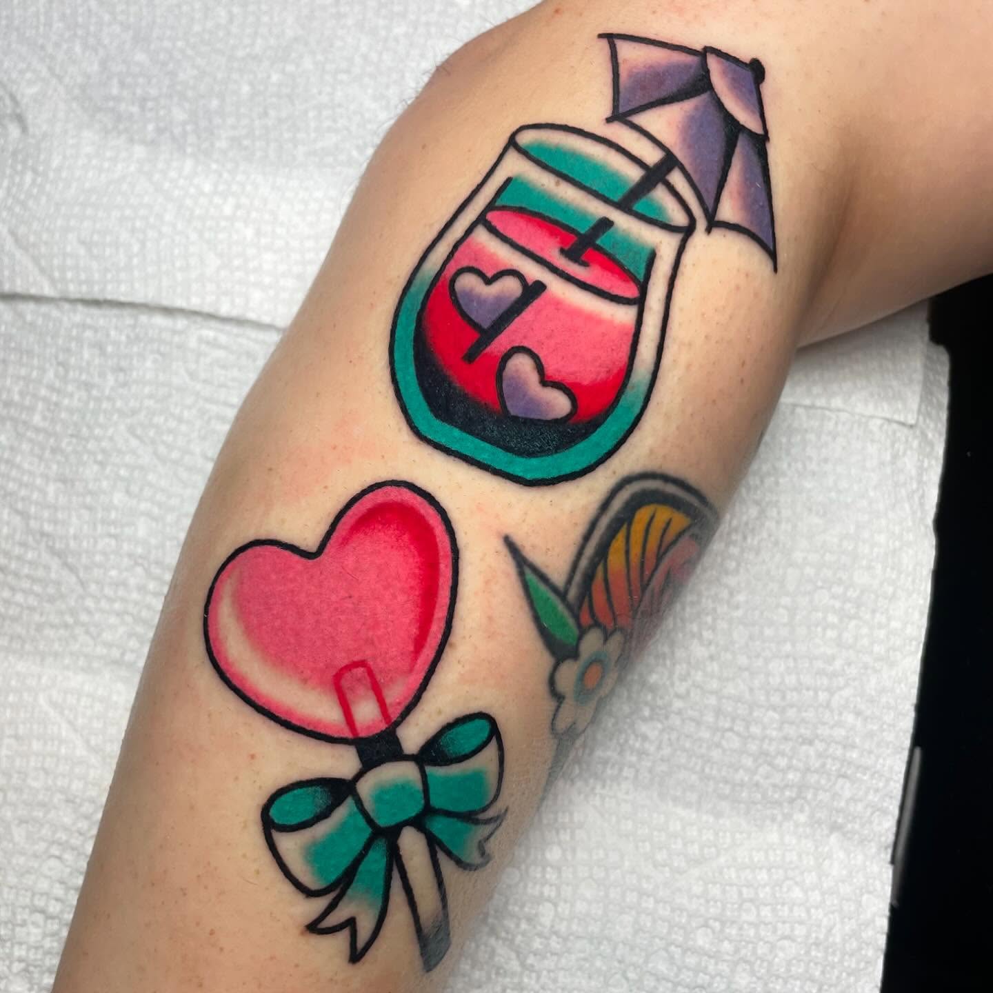Candy cane American traditional tattoo on the forearm by Nova Vaughn