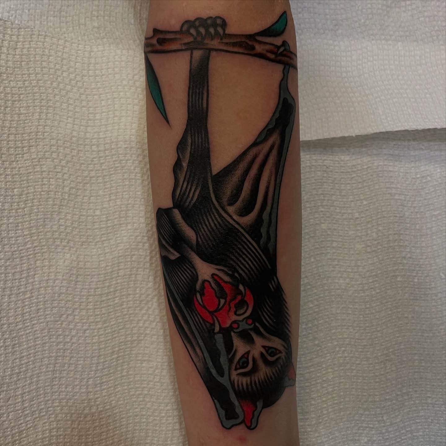 Hanging figure American traditional tattoo on the forearm by Texas Jonah