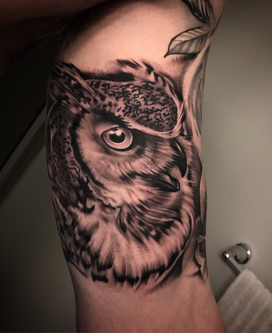 Owl realism tattoo on the forearm by Dale DeVille