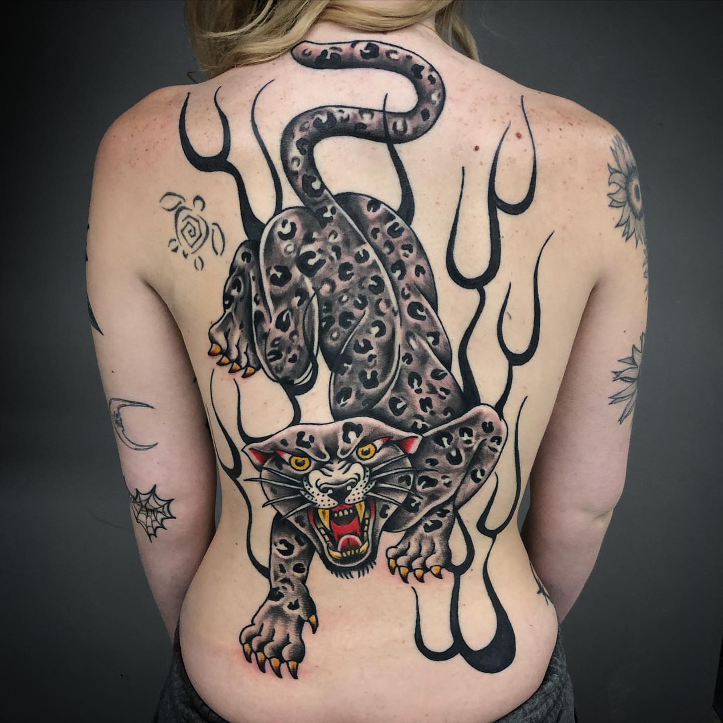 Panther American traditional tattoo on the back by Cee Marble