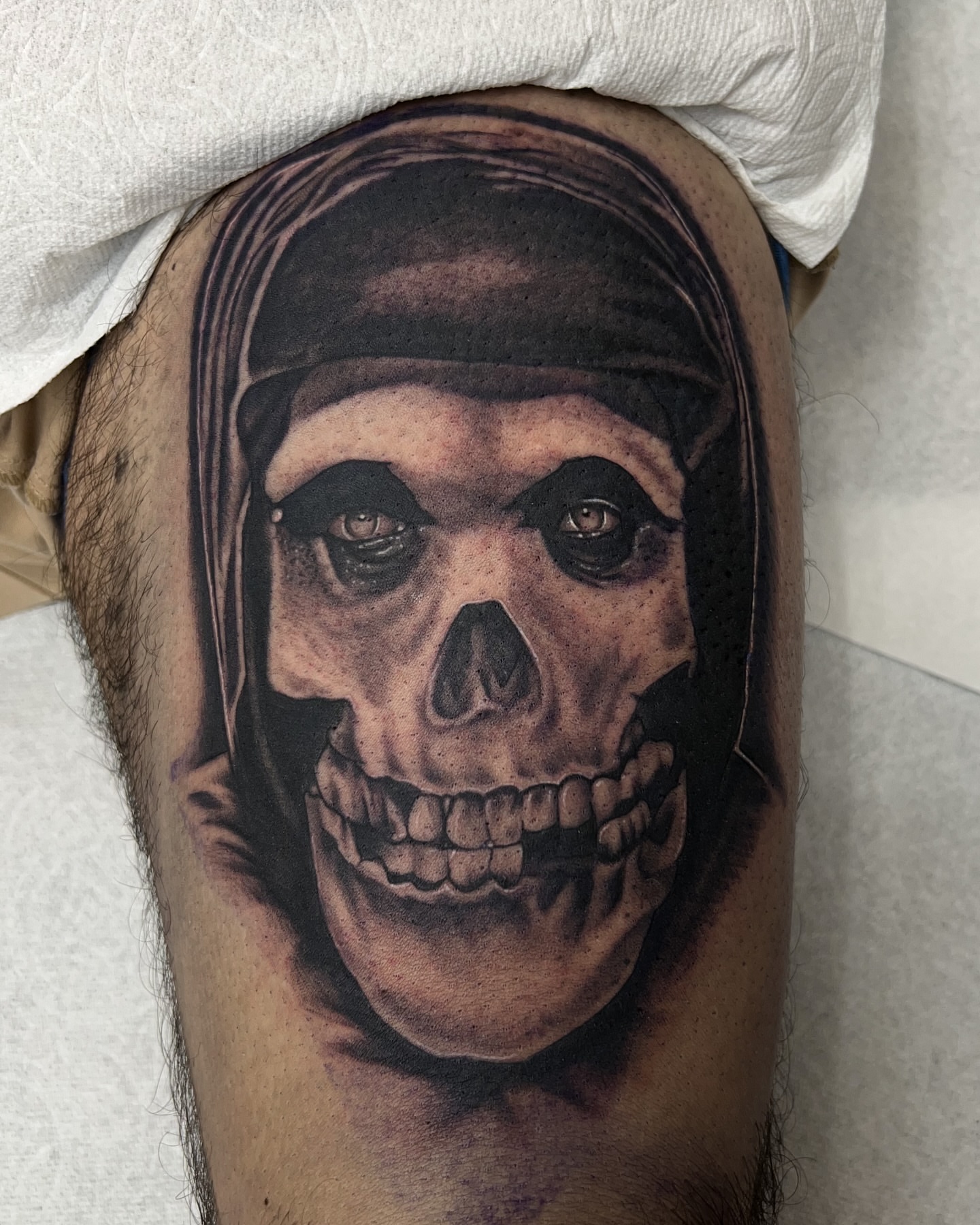 Skull dark realism tattoo on the thigh by Nick Bridwell, Downey, California