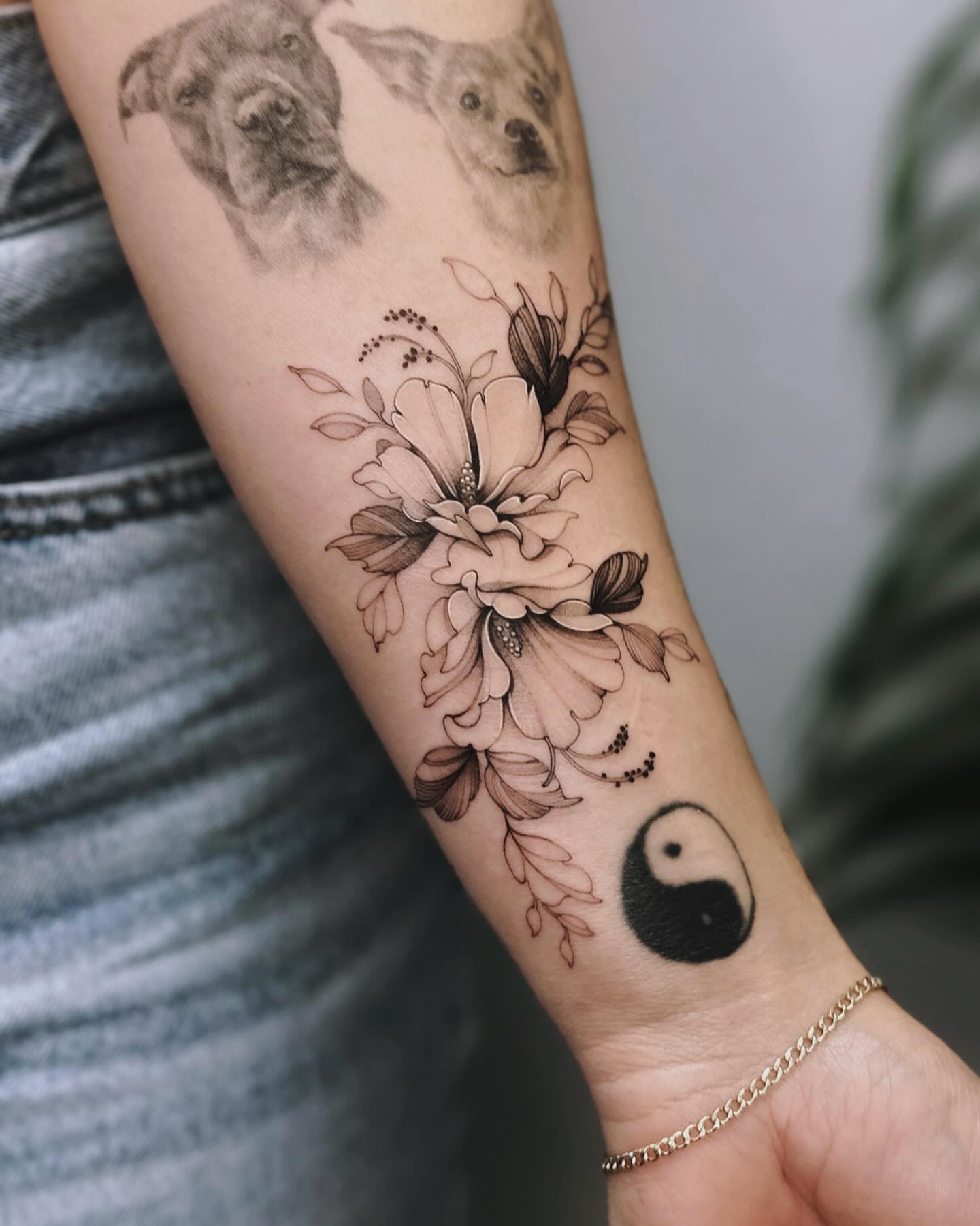 Floral bouquet realism tattoo on the forearm by Angel