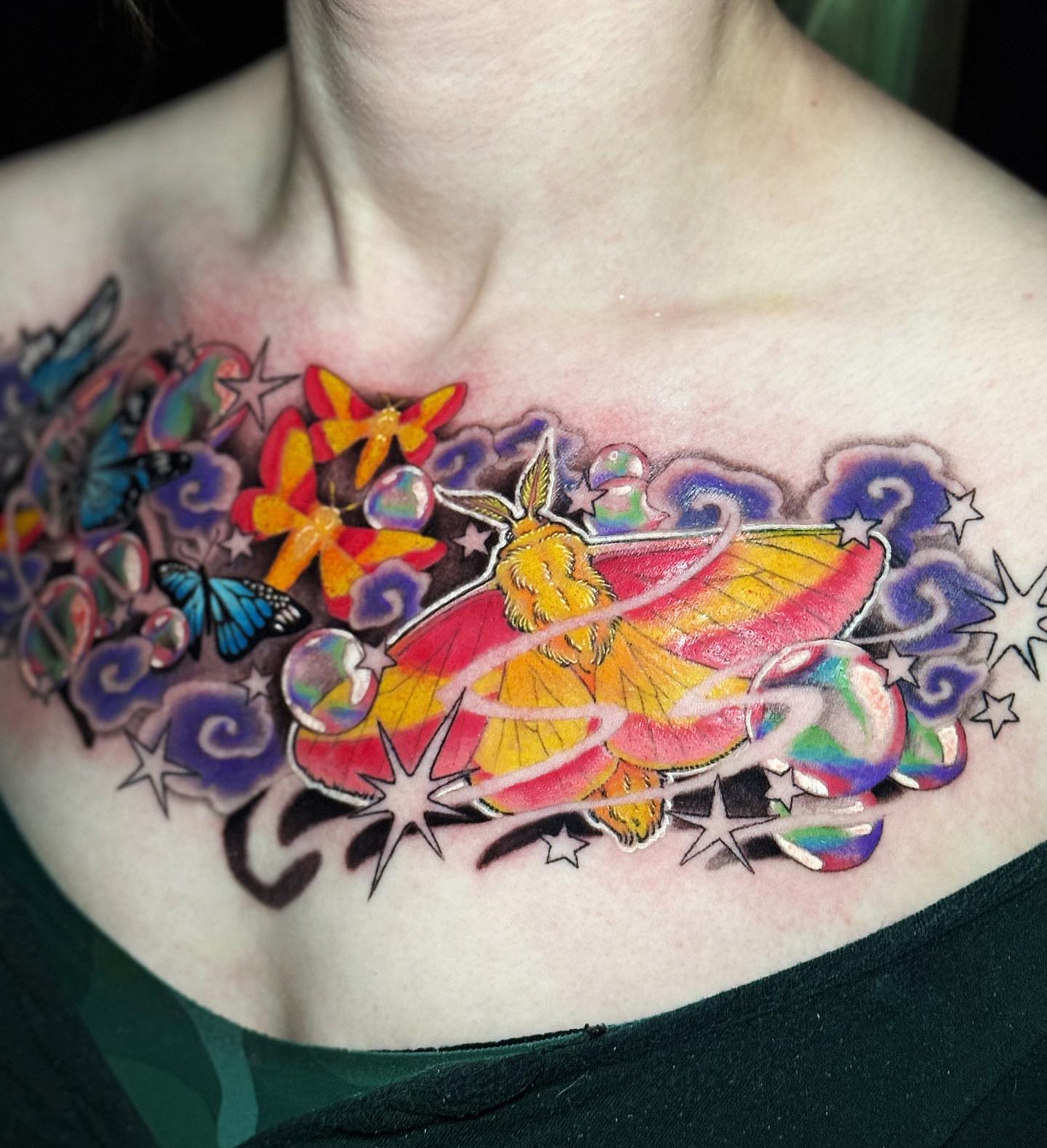 Butterfly new school tattoo on the chest by Tad Fulkerson, San Francisco, California