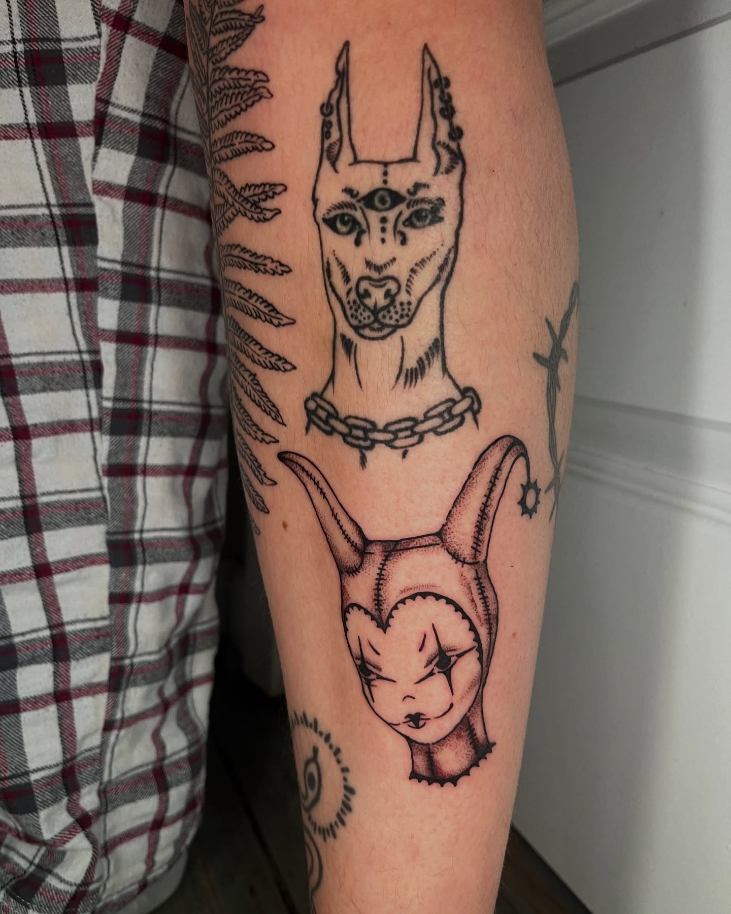 Doberman pinscher black and grey tattoo on the forearm by layne