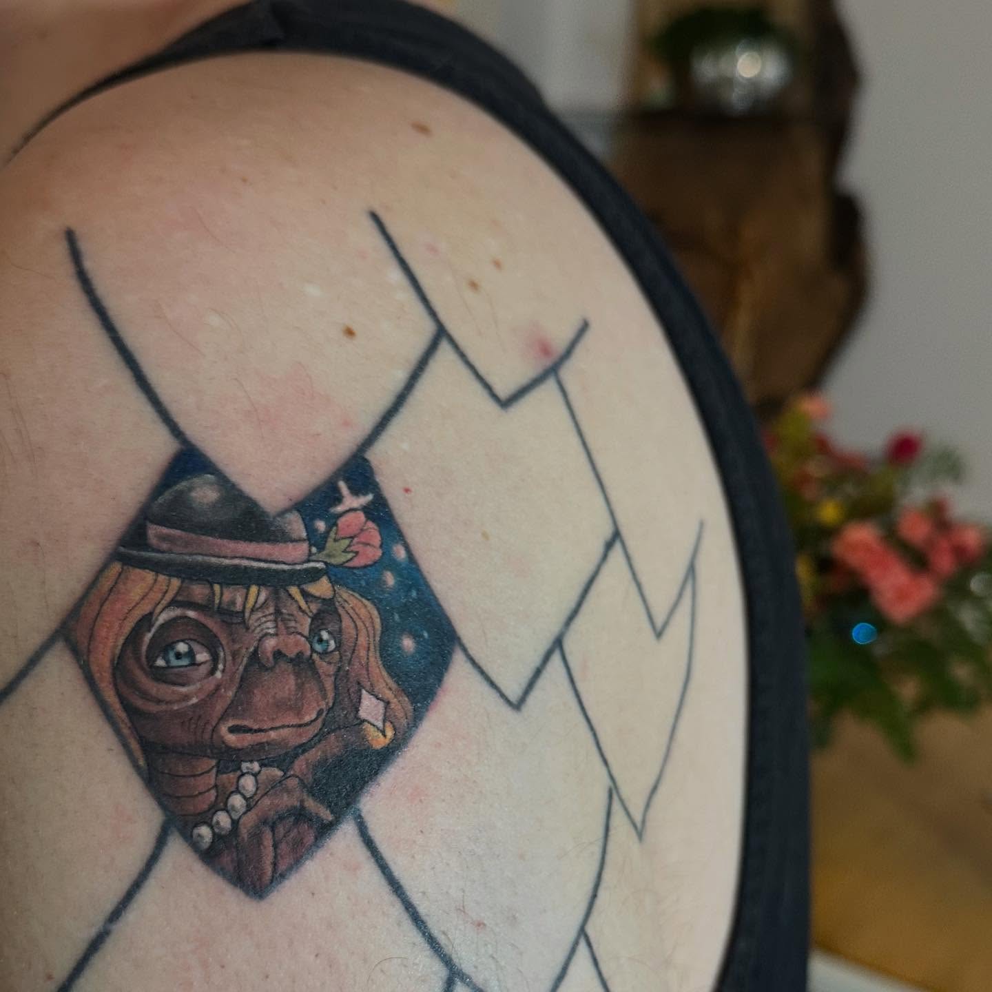 E.T realism tattoo on the shoulder by Abigail Townsend