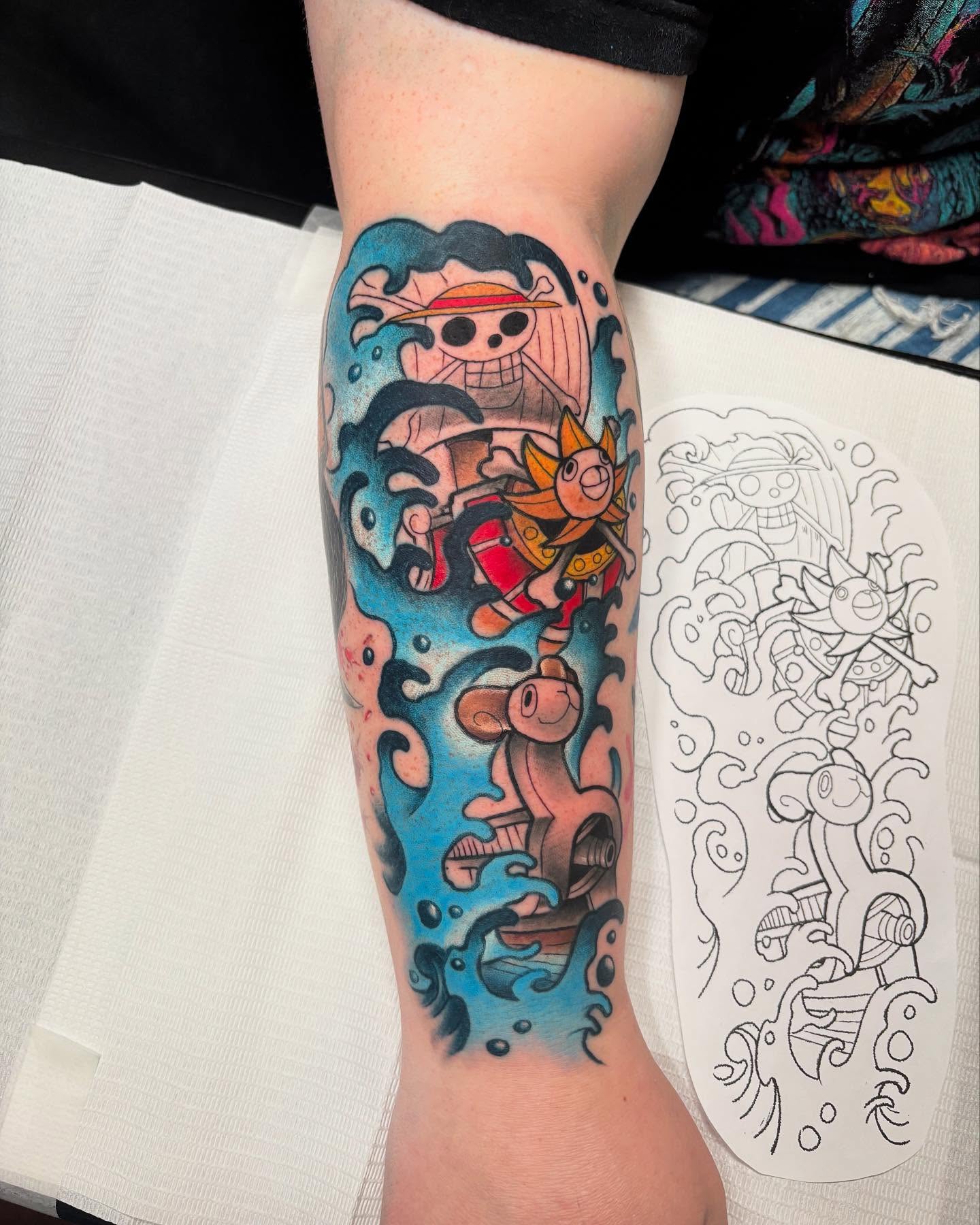 Pirate ship and characters anime tattoo on the forearm by Brian Overholt