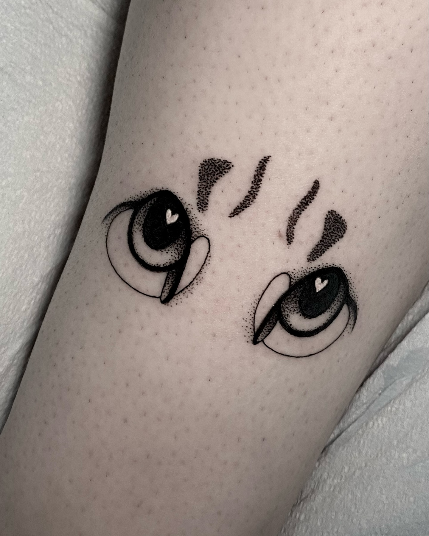 Eyes dotwork tattoo on the forearm by Rowan Starr