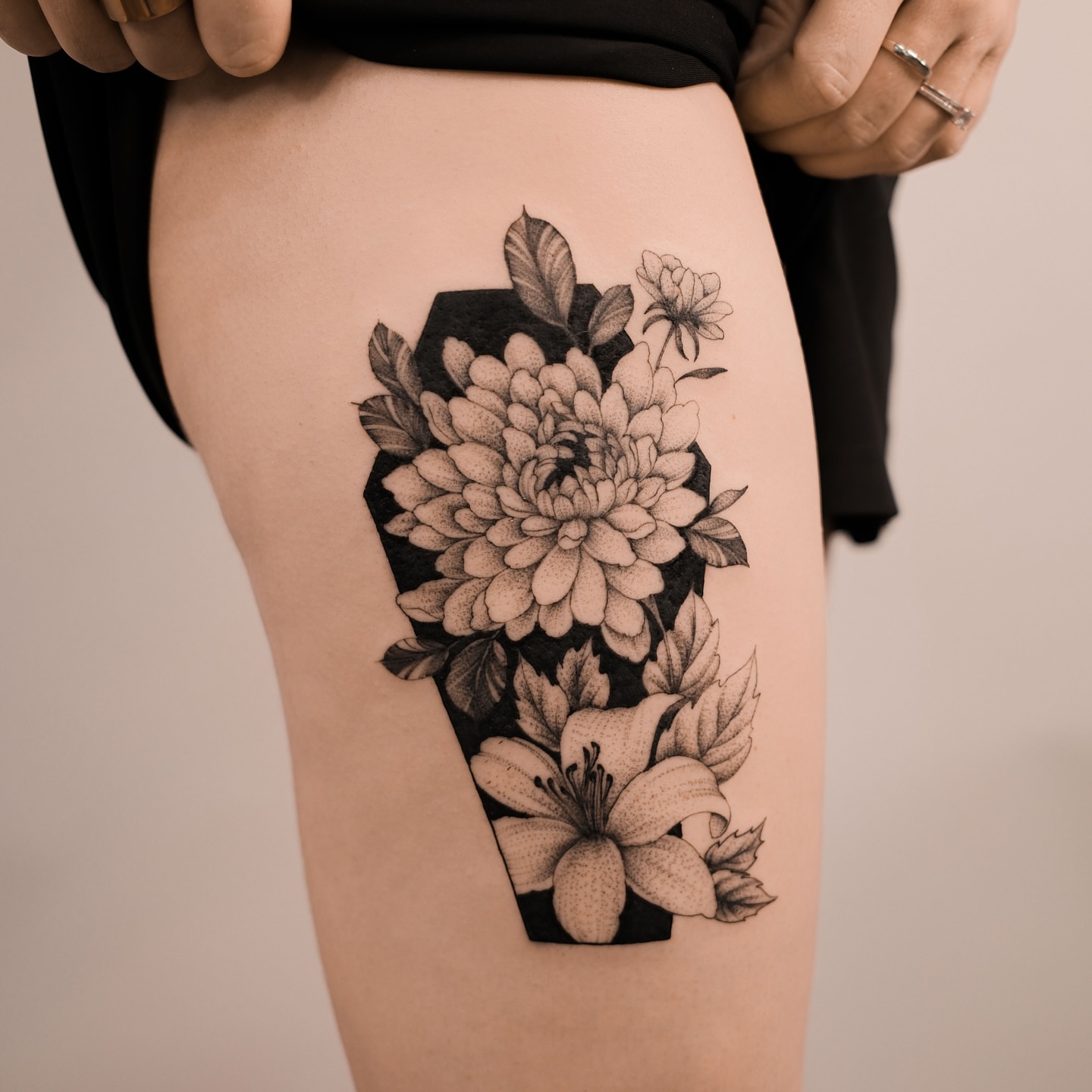 Floral bouquet dotwork tattoo on the thigh by Sky Ng Tattoo Artist in Katy