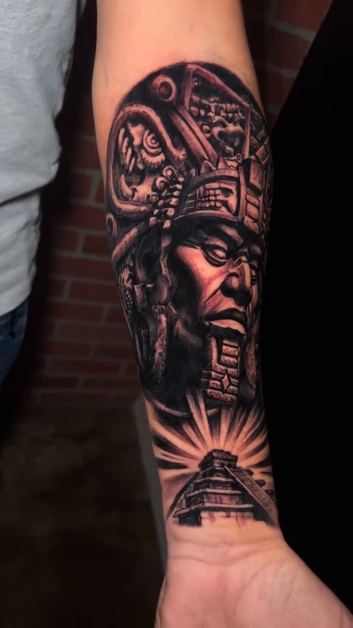 Aztec warrior and pyramid realism tattoo by Raul Ugarte, Roseville, California