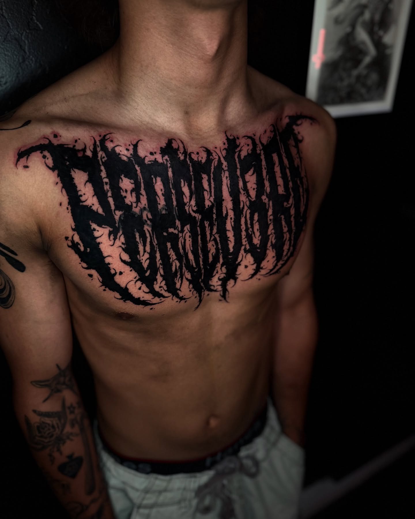 Lettering lettering script tattoo on the chest by Isaac