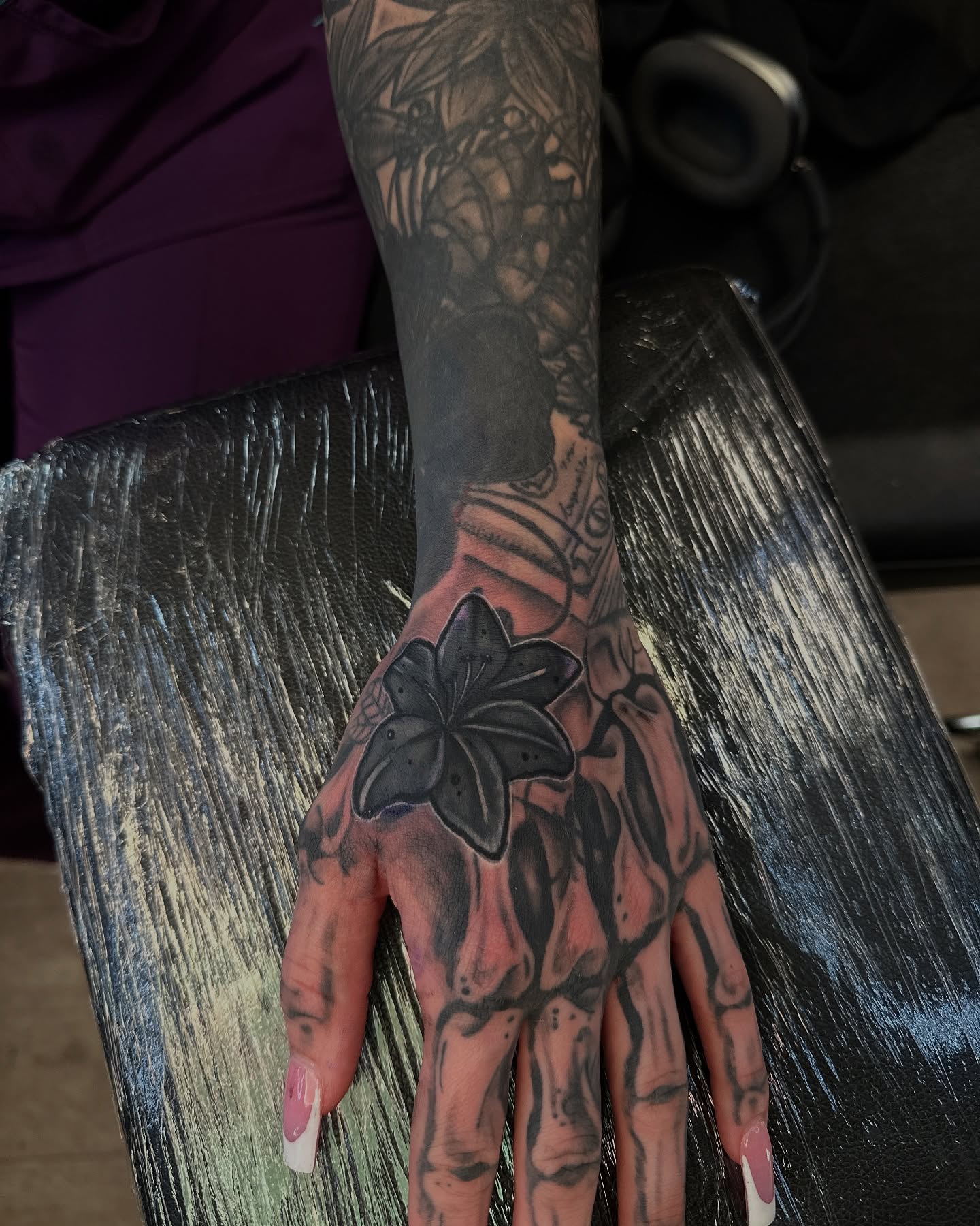 Lily black and grey tattoo on the hand by ᴡᴏʀᴍ