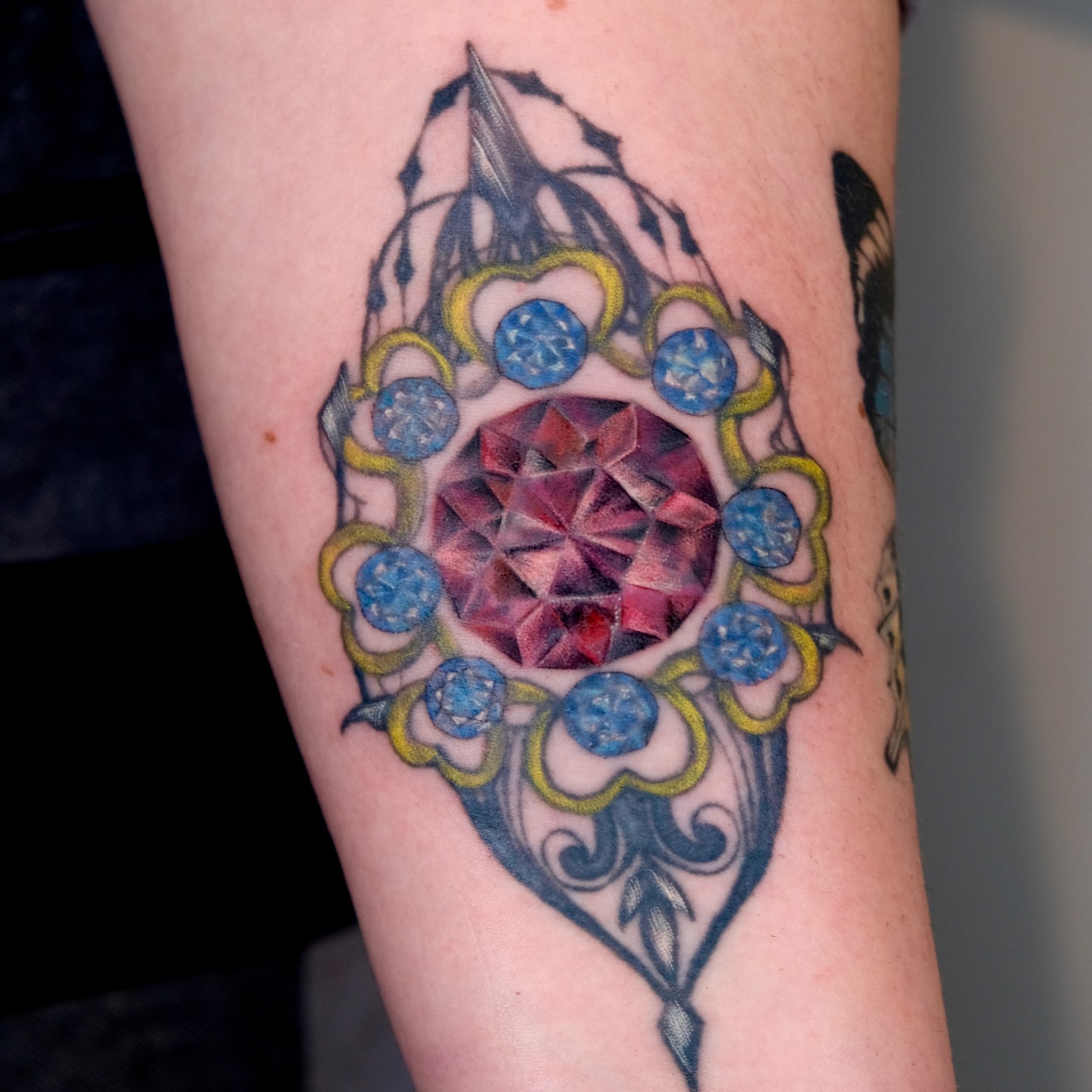 Gemstone geometric tattoo on the forearm by Ka hiu chiu
