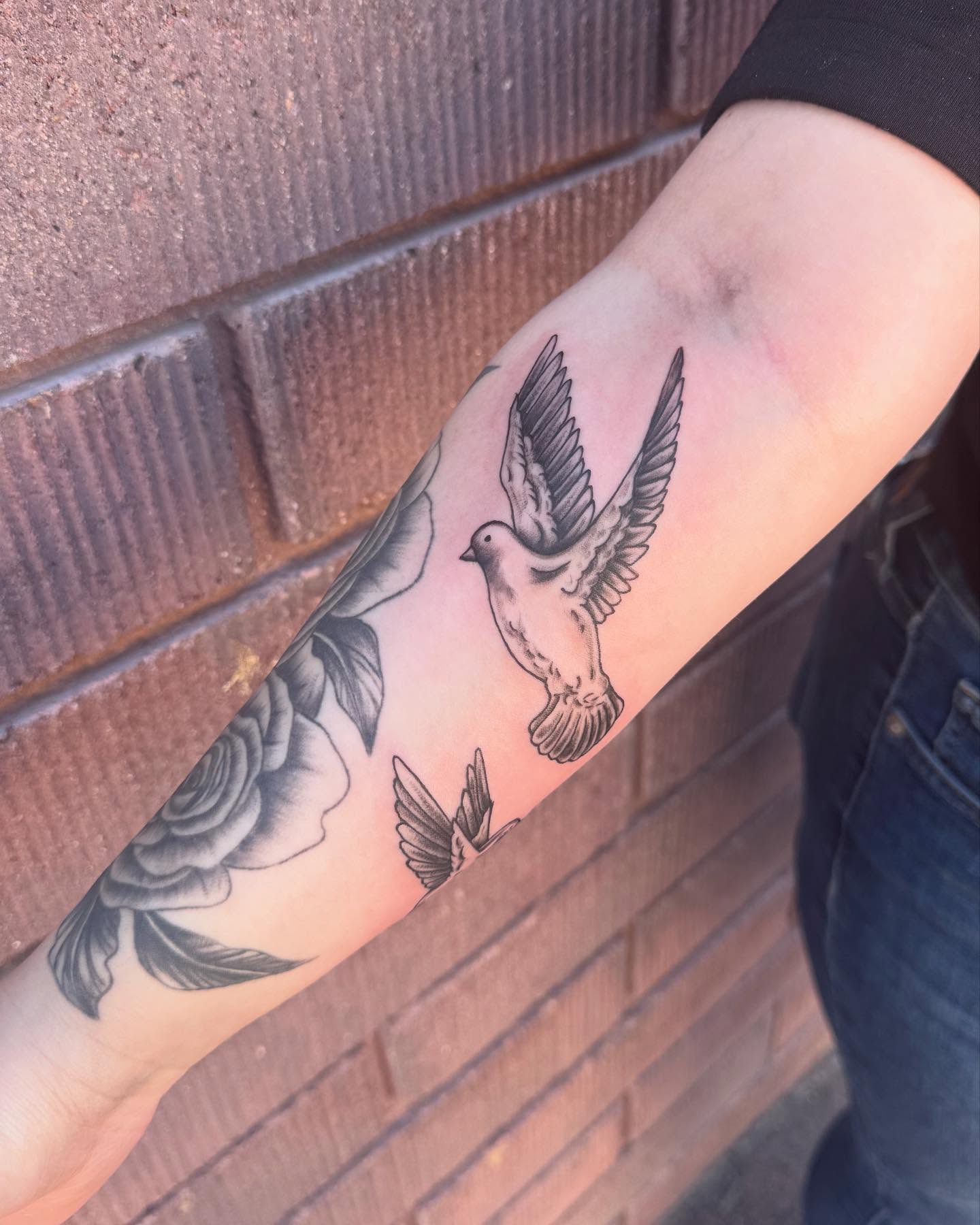 Dove and roses black and grey tattoo on the forearm by Jianna