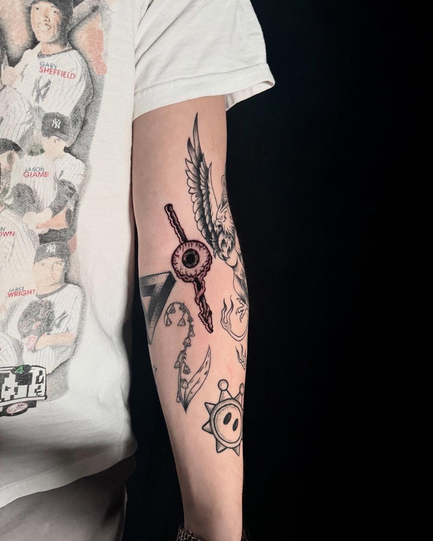 Eye and key black and grey tattoo on the forearm by Alex Richardson
