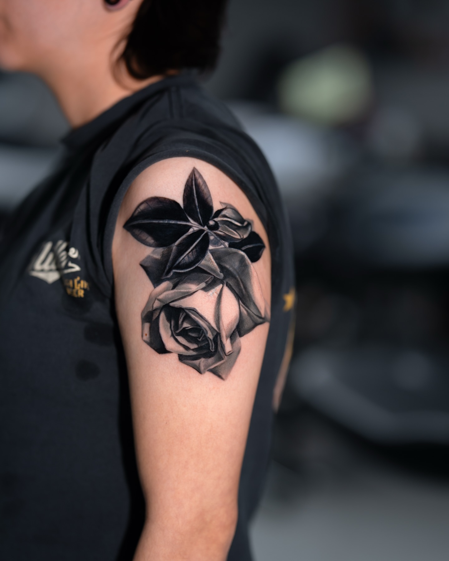 Rose realism tattoo on the shoulder by Joey Hella Tattoo Artist