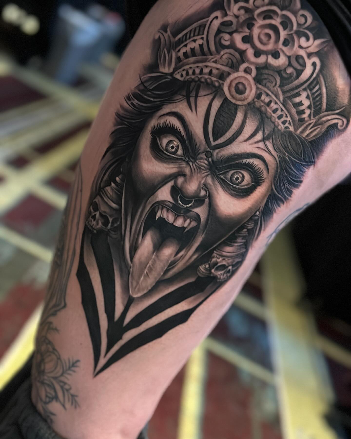 Demon face realism tattoo on the forearm by Aaron Watson