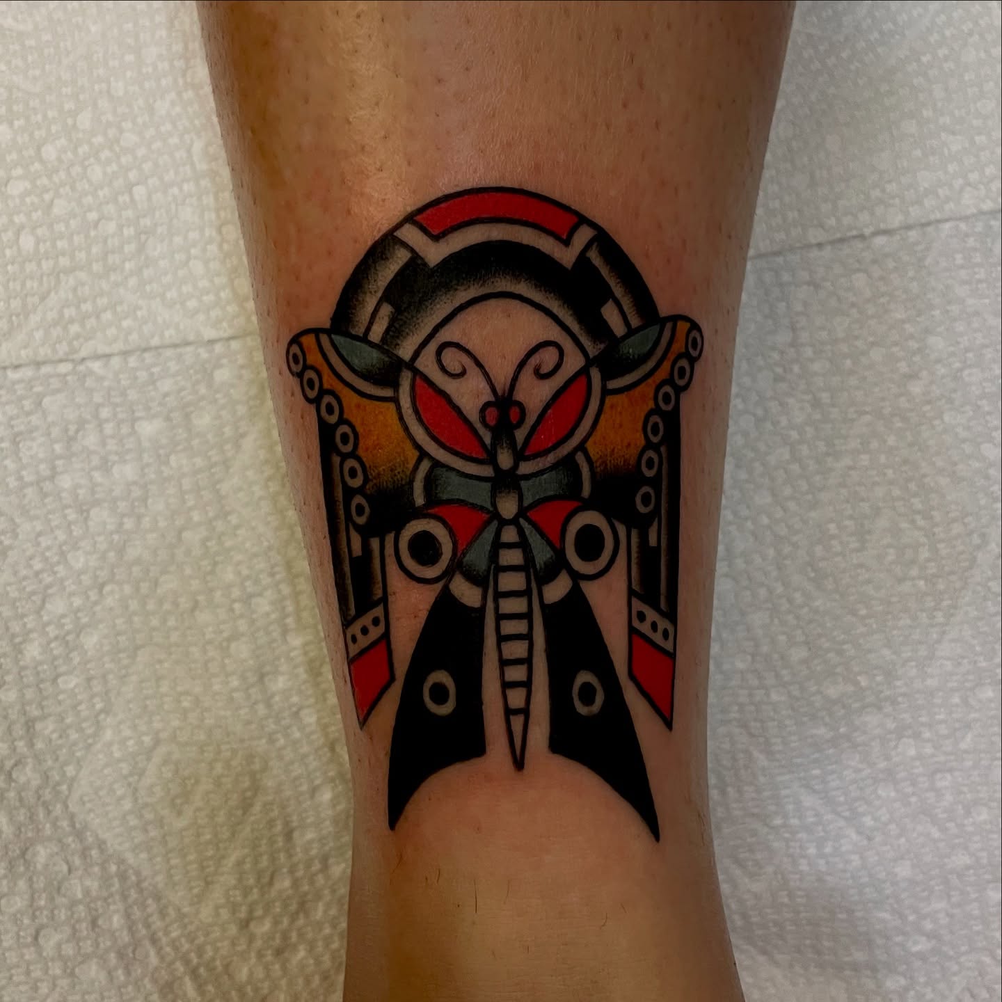 Butterfly American traditional tattoo on the forearm by Texas Jonah