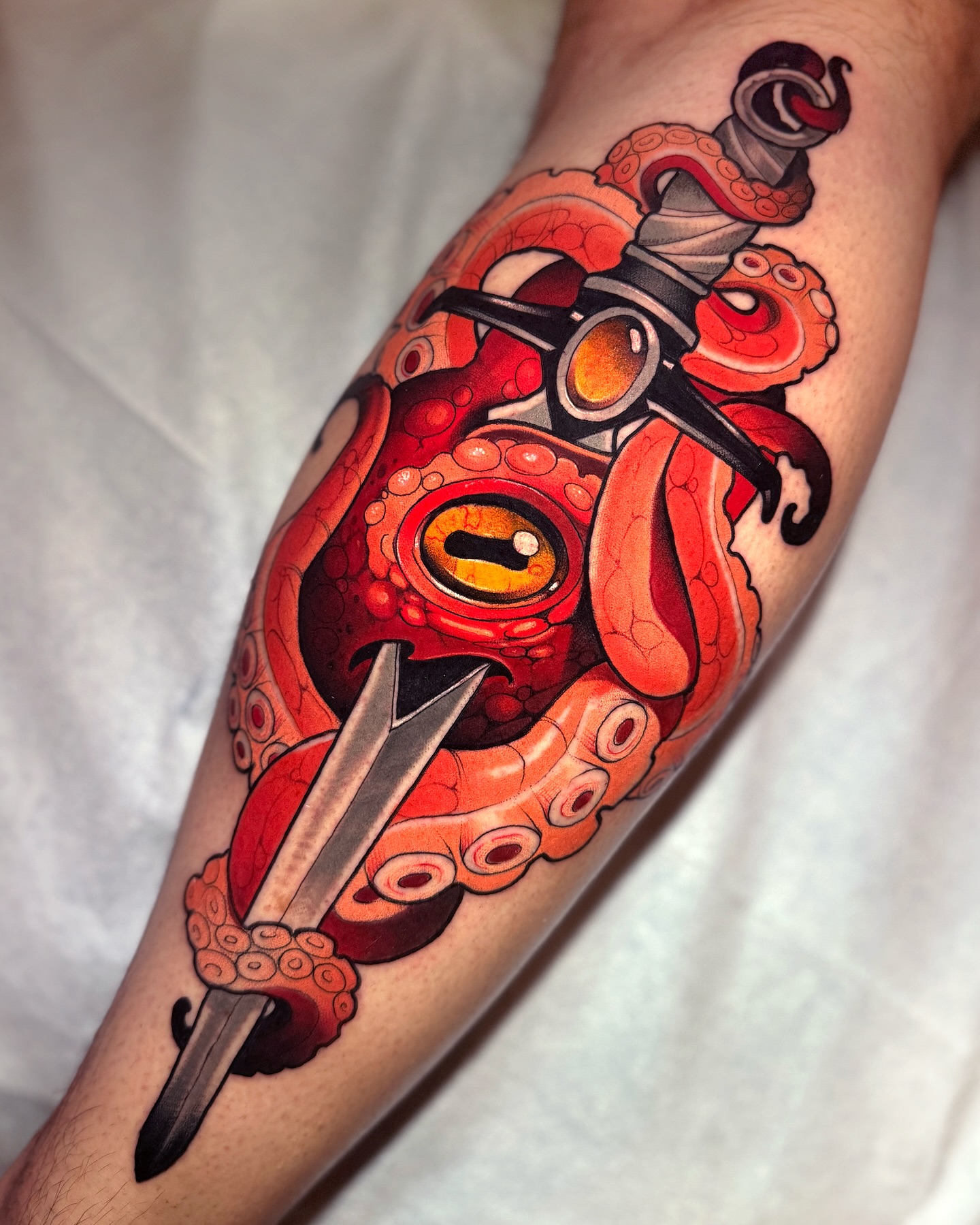 Octopus and dagger American traditional tattoo on the forearm by Matt - Neotrad Tattoos, New York, New York