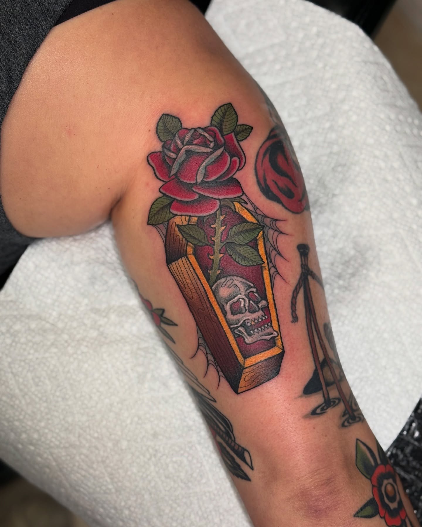 Coffin with rose American traditional tattoo on the forearm by K9