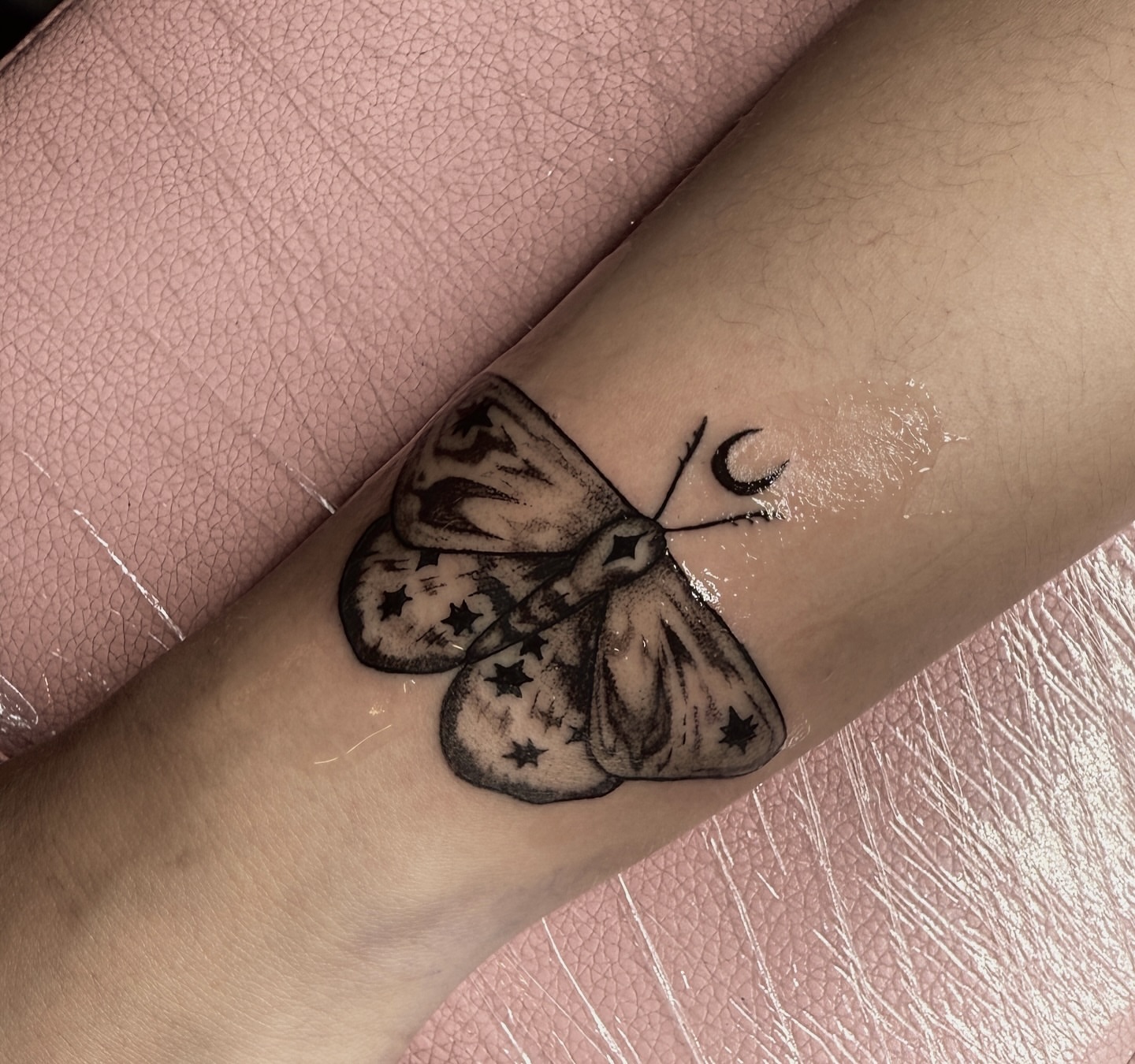 Butterfly black and grey tattoo on the forearm by V