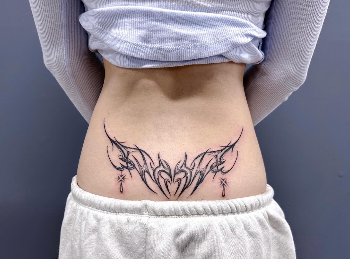Tribal design tribal tattoo on the torso by mia's tattoo, Los Angeles, California