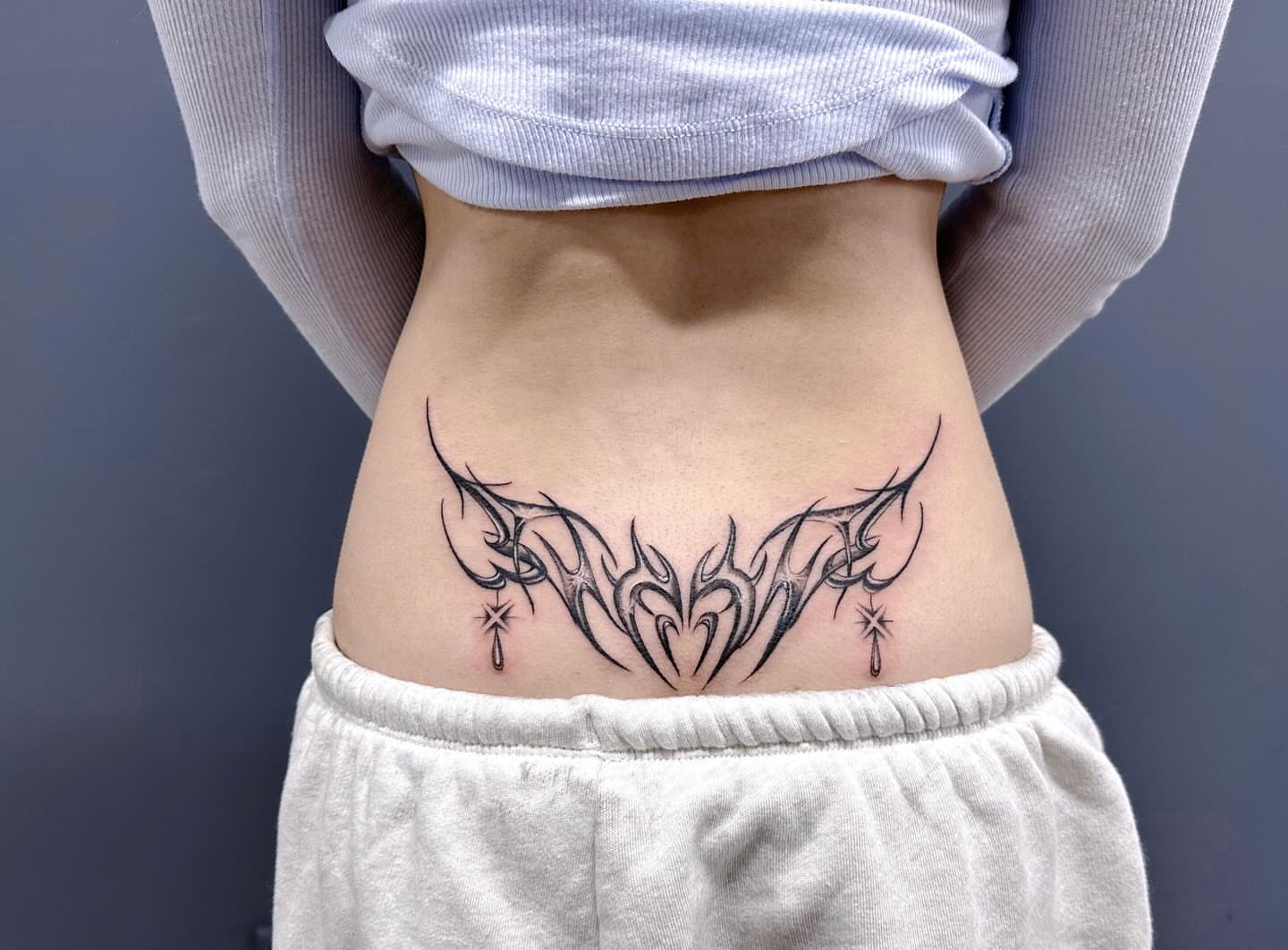 Tribal design tribal tattoo on the torso by mia's tattoo, Los Angeles, California