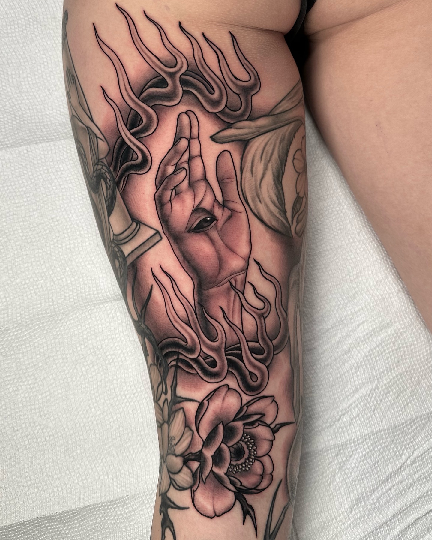 Flames and hands realism tattoo on the forearm by Henry Gaßner