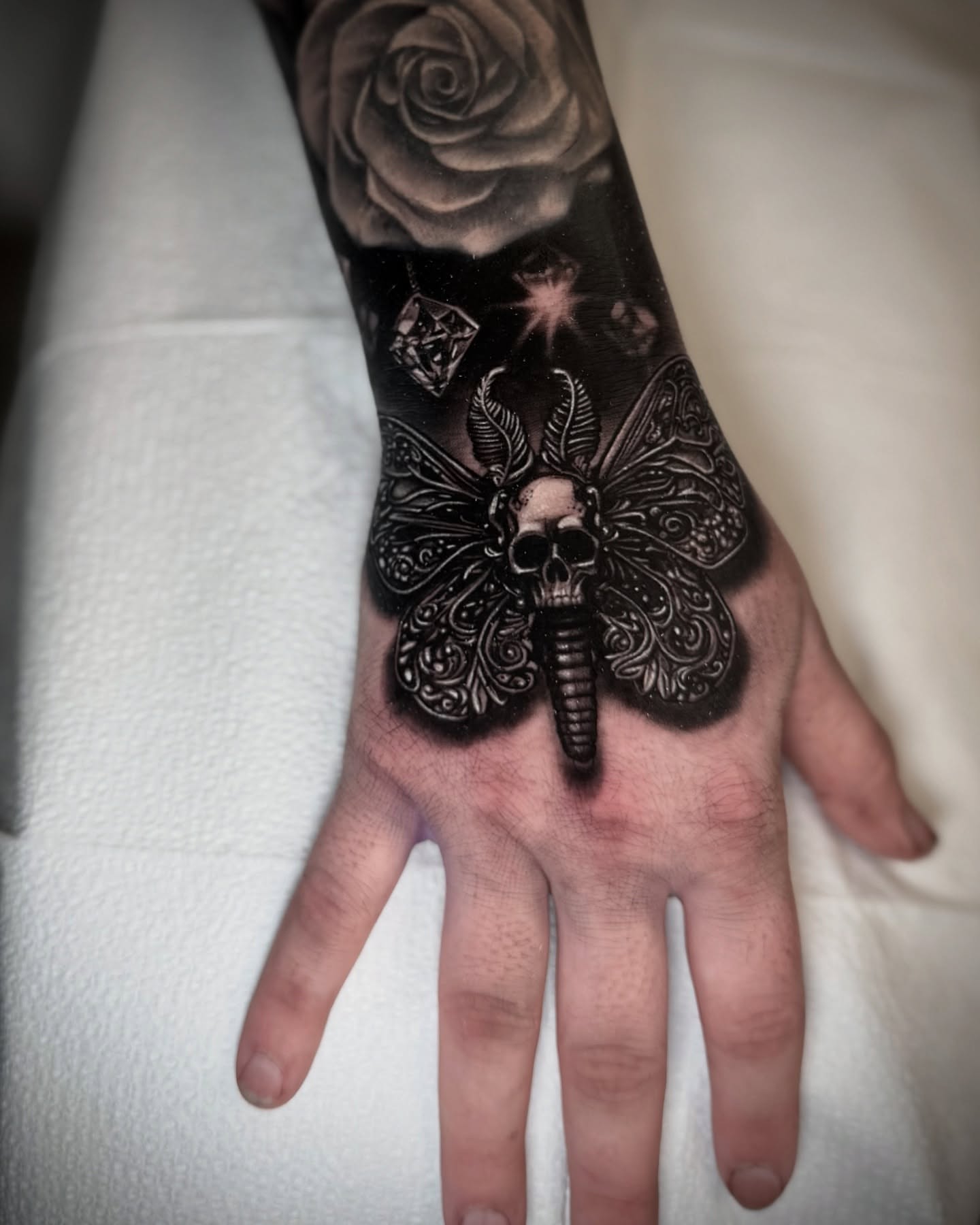 Tattoo by @caroline_yurek_tattoo — black_and_grey, dark_realism