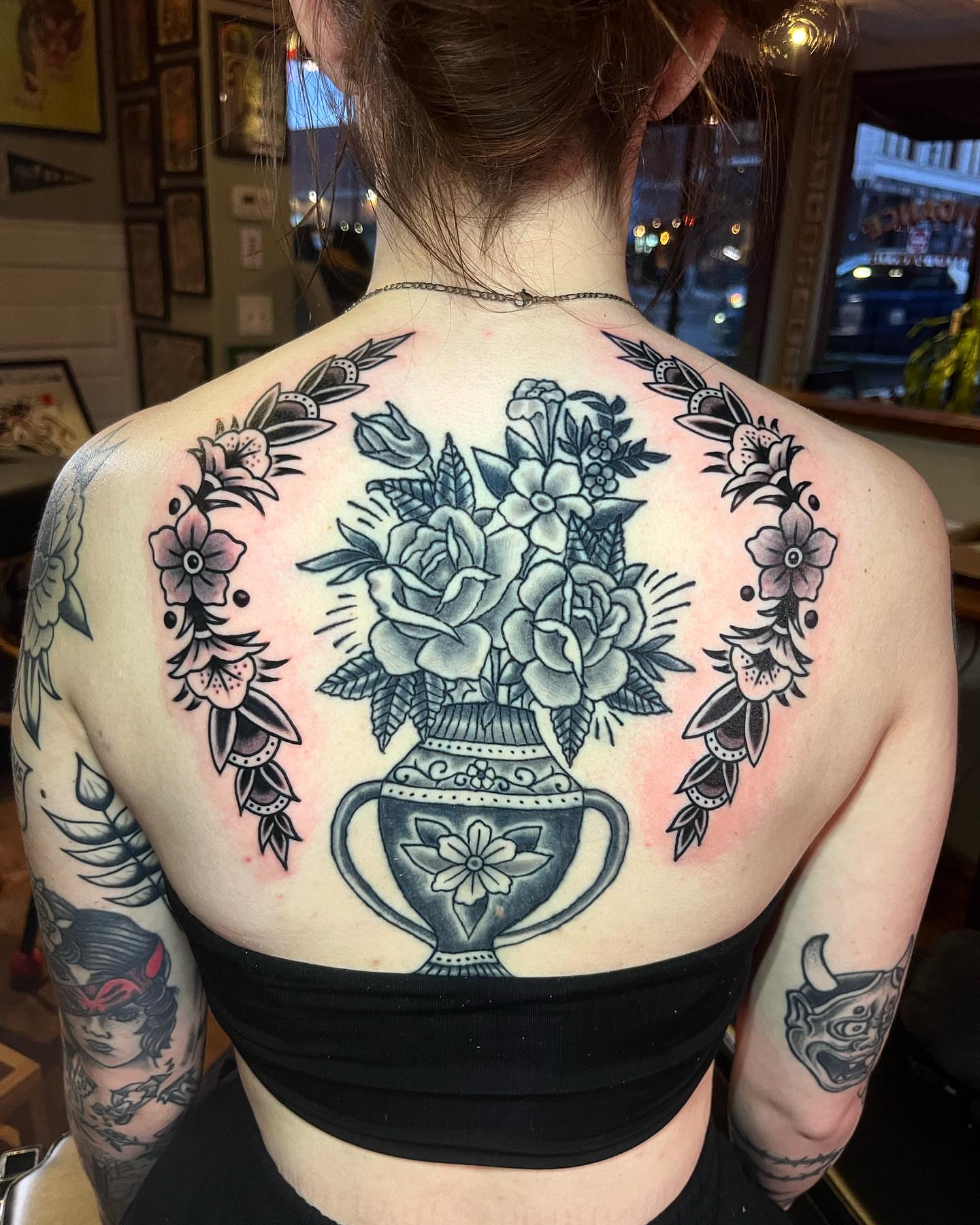 Flower bouquet American traditional tattoo on the back by Jake LiCausi