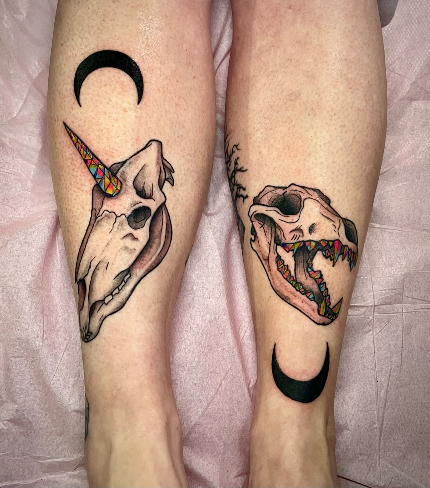 Skull and crescent moon geometric tattoo on the calf by Liv