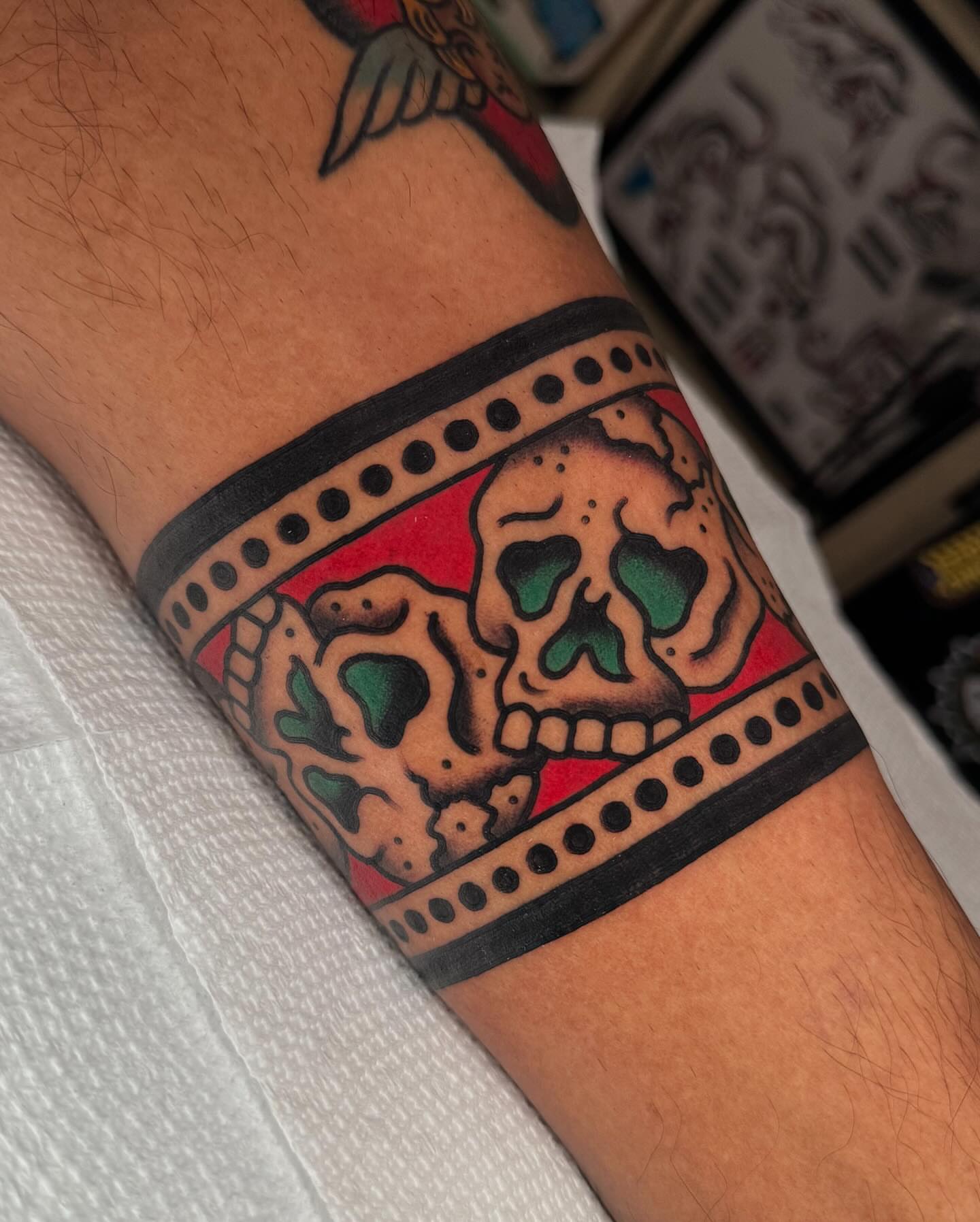 Skulls American traditional tattoo on the forearm by James Shepherd, Austin, Texas