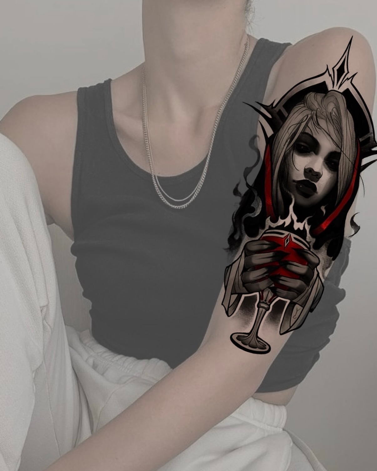 Woman with red hood dark realism tattoo on the forearm by Kris Tattoo Chicago