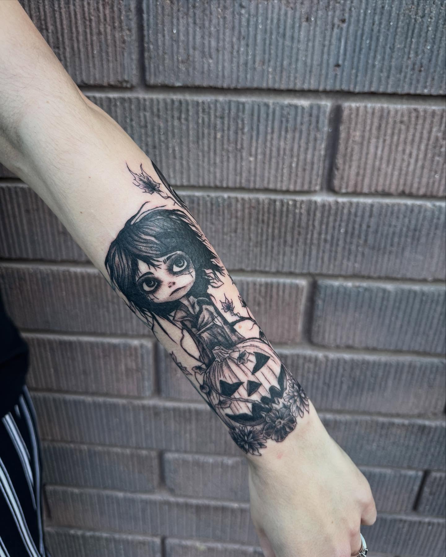 Doll realism tattoo on the forearm by Jianna