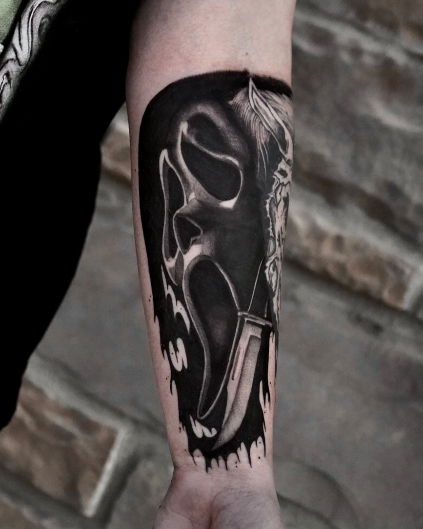 Skull and dagger realism tattoo on the forearm by Tattoo Artist