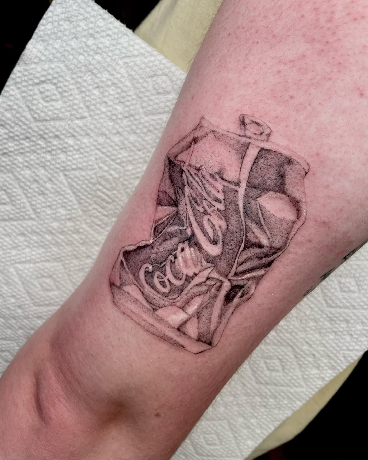 Coca-Cola bottle black and grey tattoo on the forearm by madison, Cincinnati