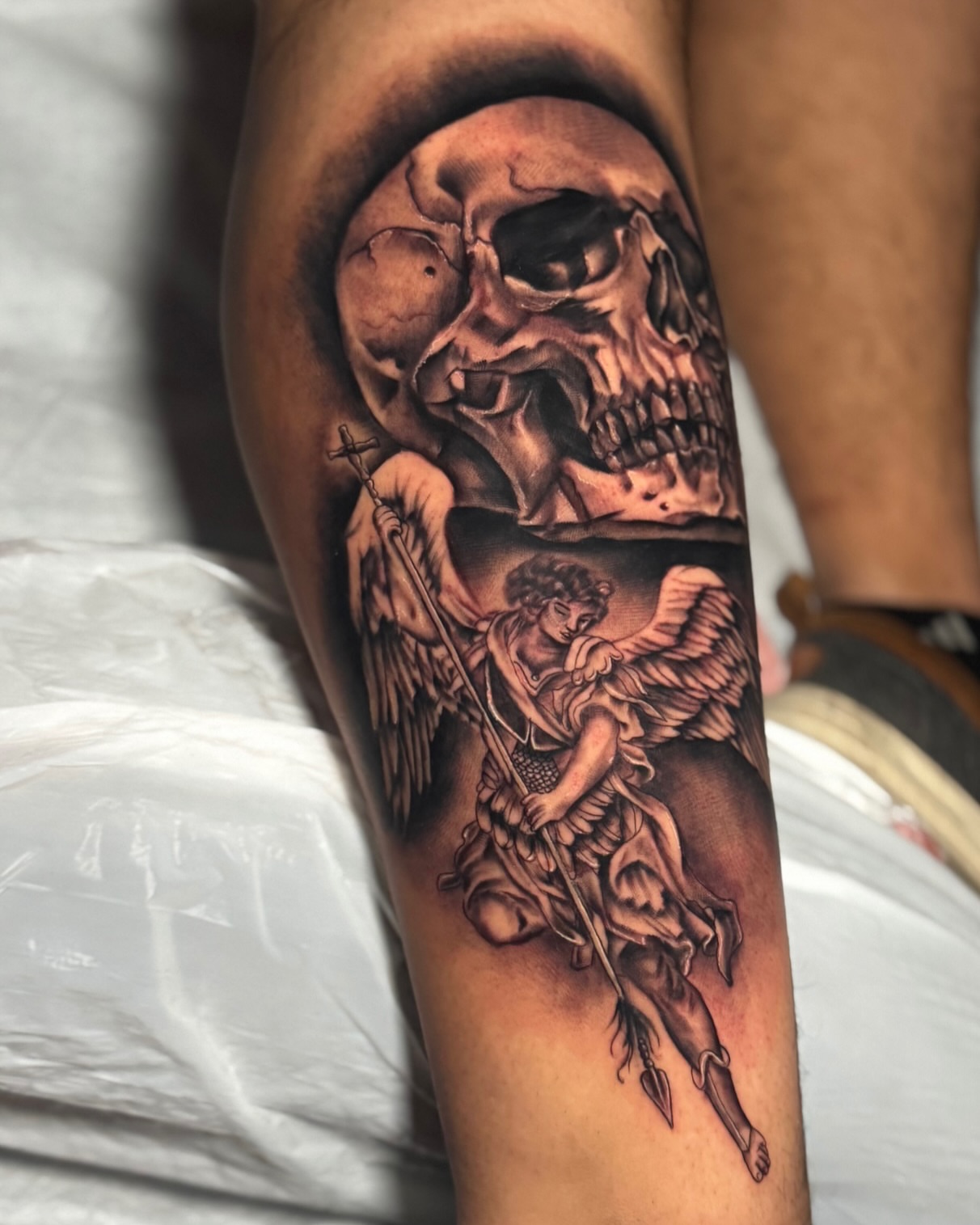 Angel with crossbow realism tattoo on the forearm by Tattoo Artist