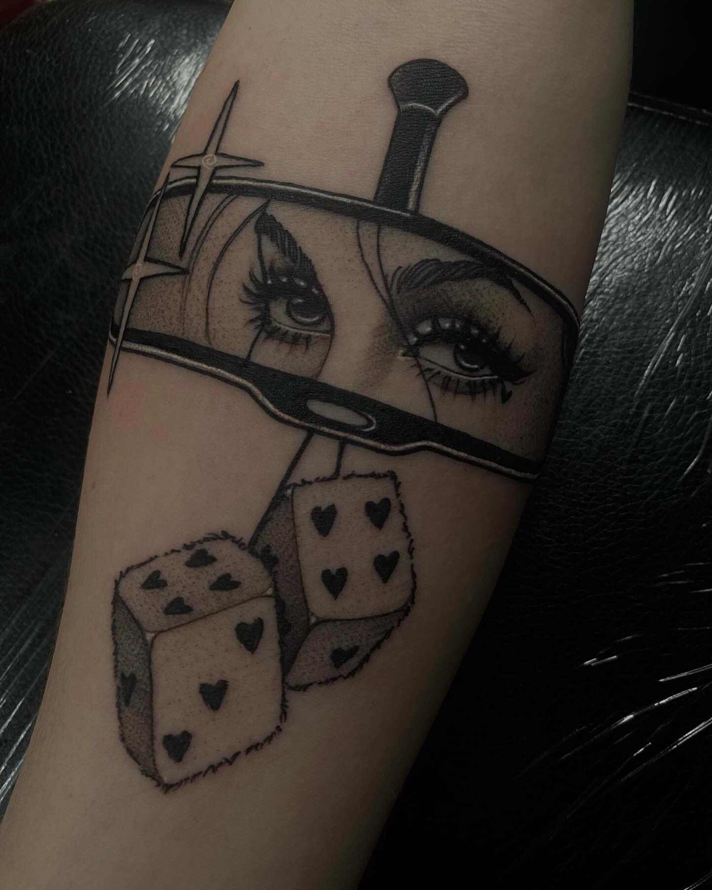 Woman's face with dice realism tattoo on the forearm by 𝔗𝔞𝔶𝔩𝔬𝔯 𝔈𝔩𝔦𝔷𝔞𝔟𝔢𝔱𝔥, Tulsa, Oklahoma