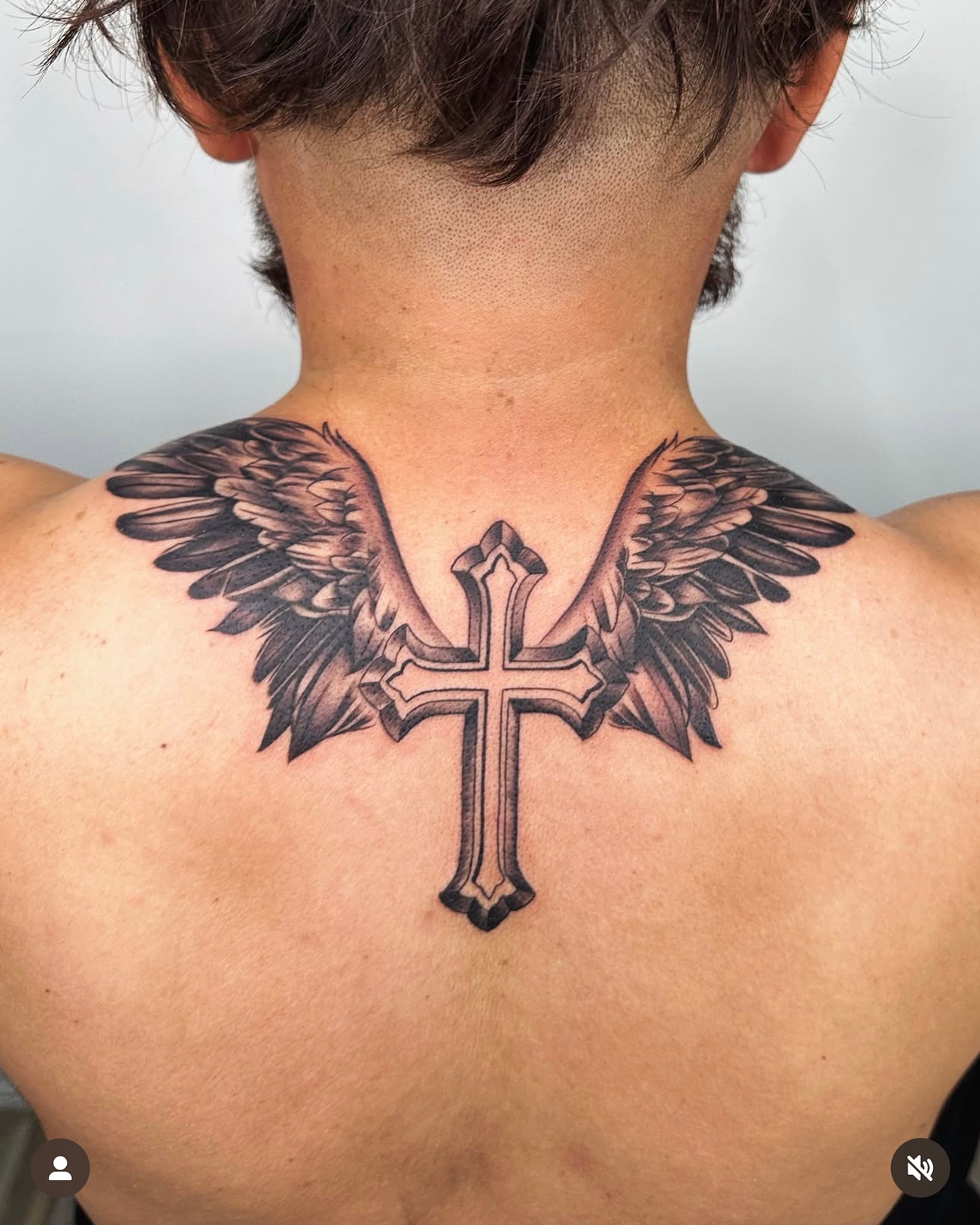 Cross with wings black and grey tattoo on the back by 📍 Austin